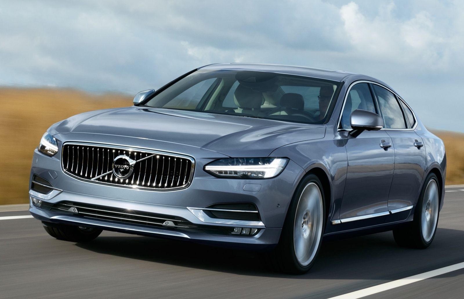 Silver 2017 pale blue volvo s90 on the road
