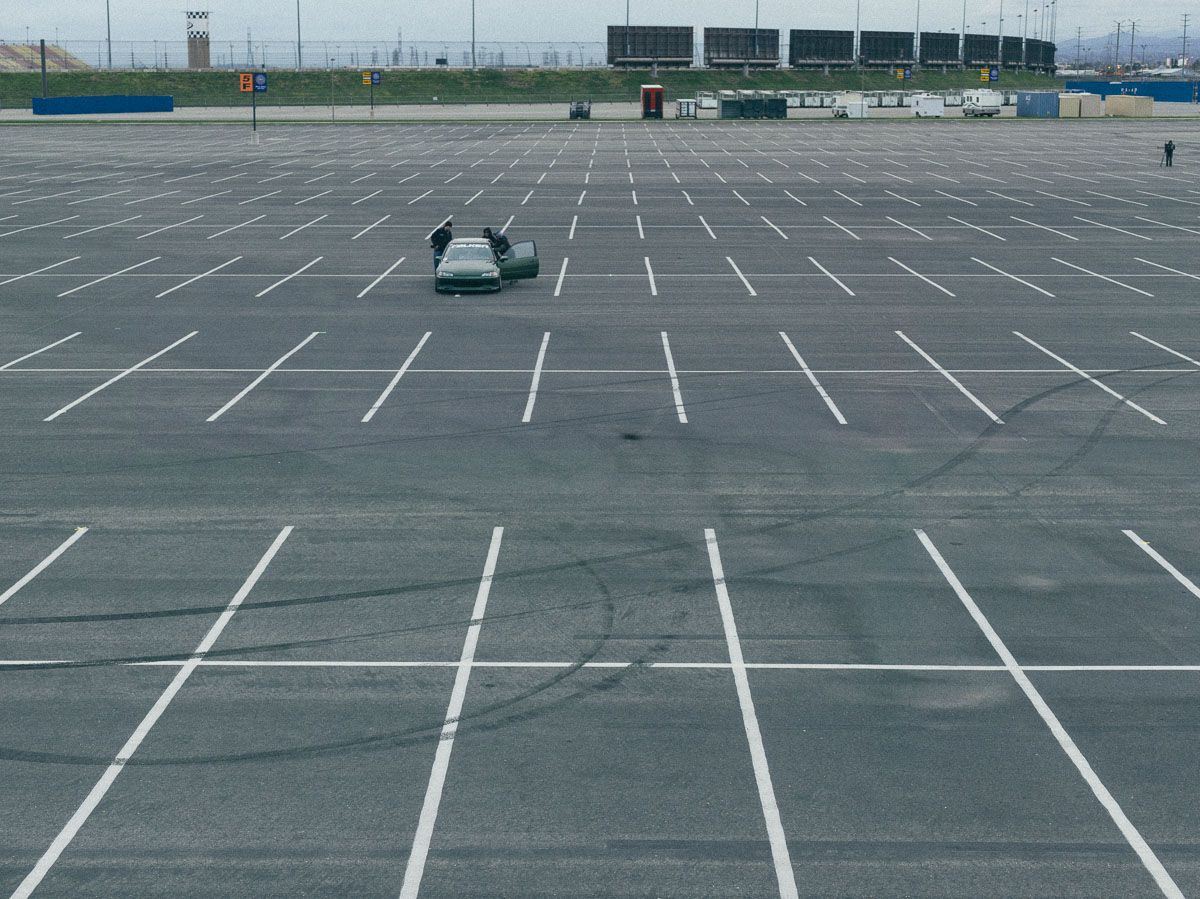 Car in empty parking lot