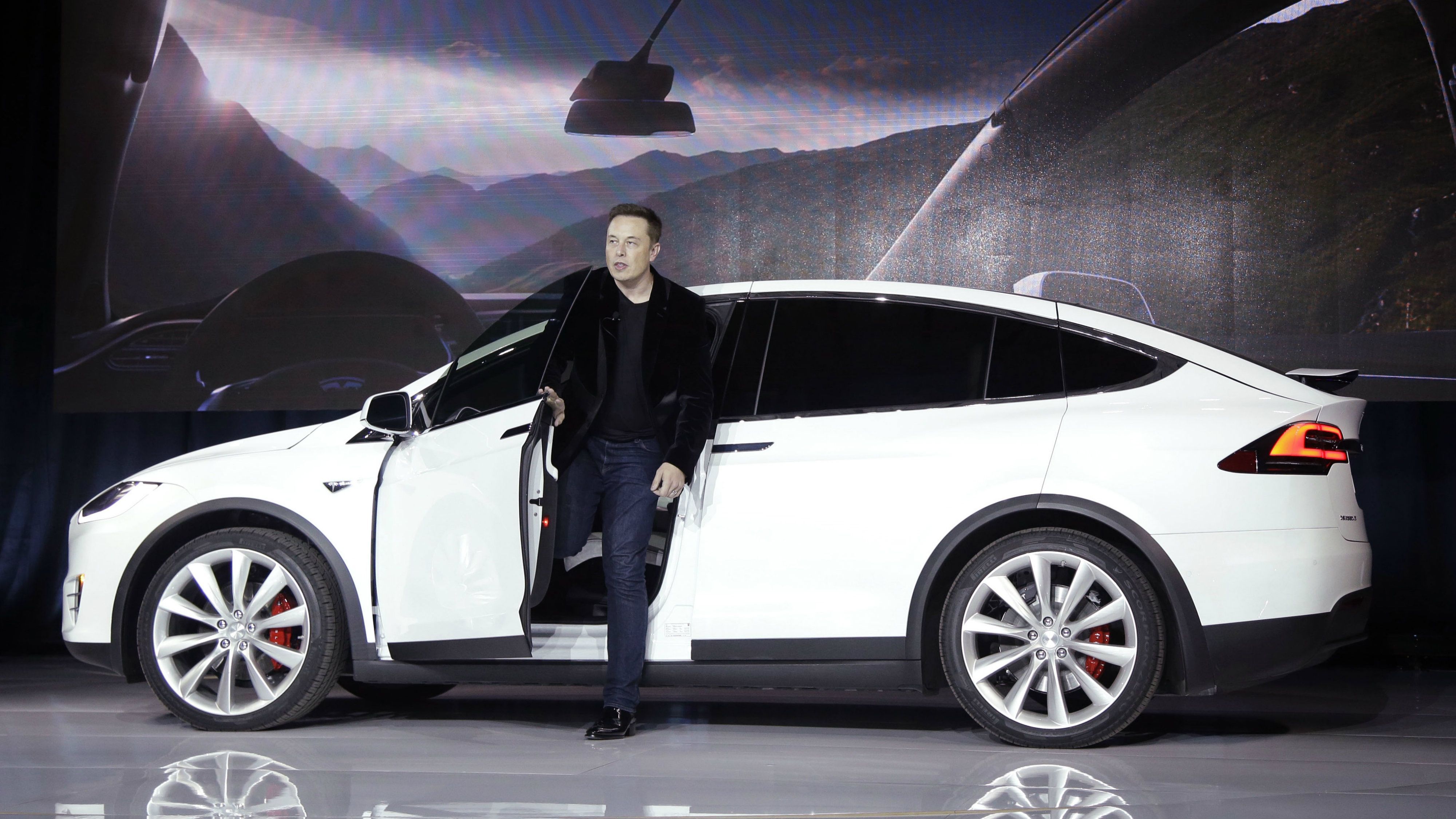 Elon Musk w white Tesla