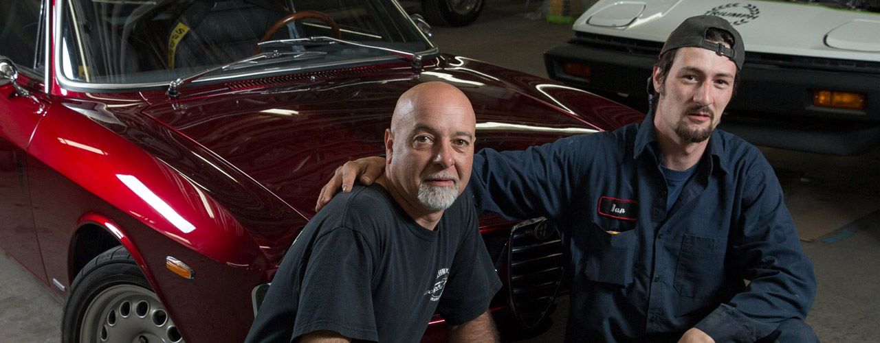 Restoration Garage's Host Standing In Front Of Car