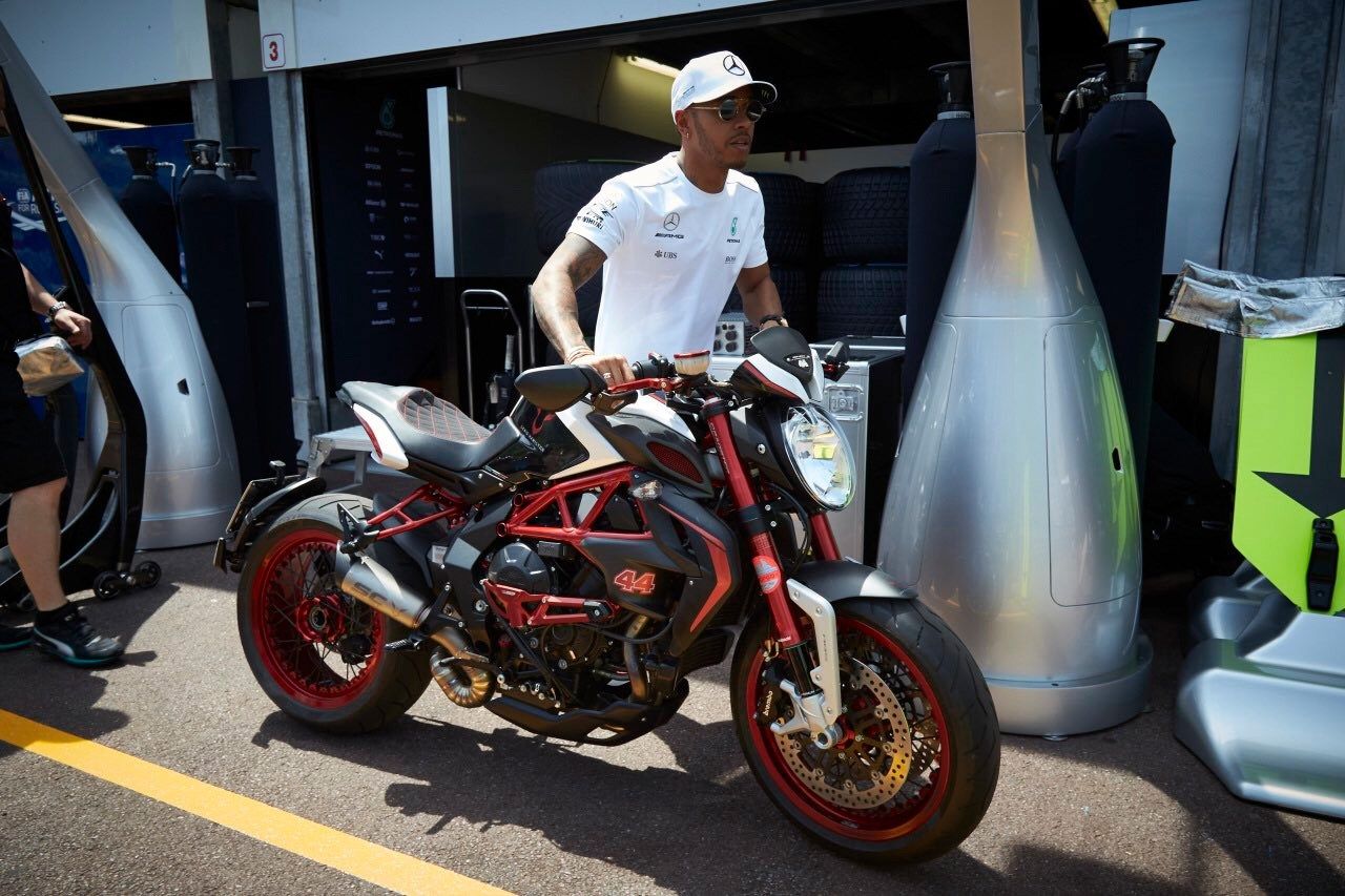 Lewis Hamilton with a motorbike