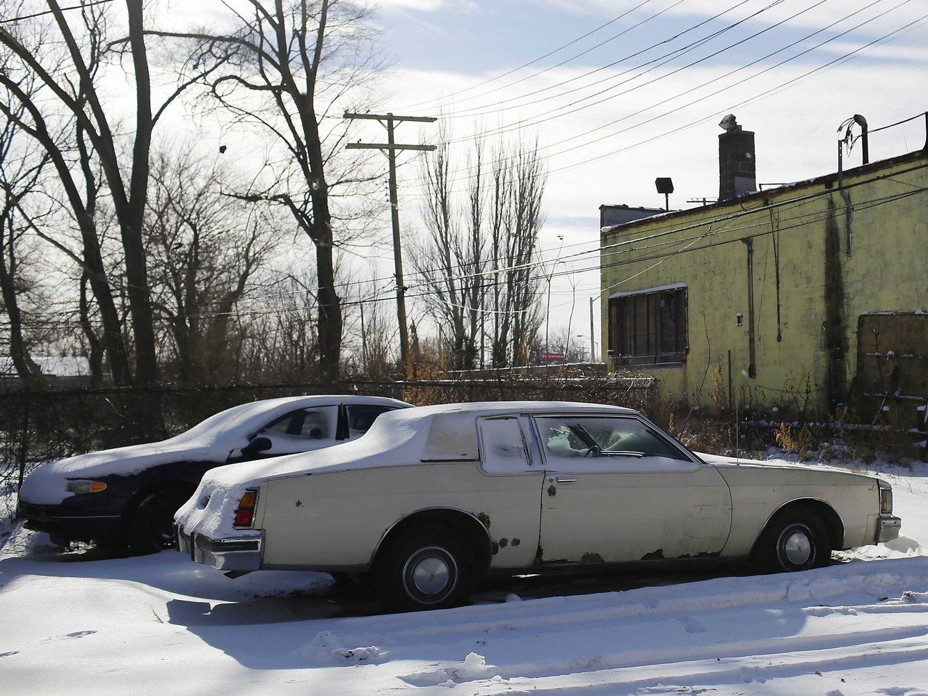 20 Photos Of Cars And Dealerships In Detroit That Were Left Behind