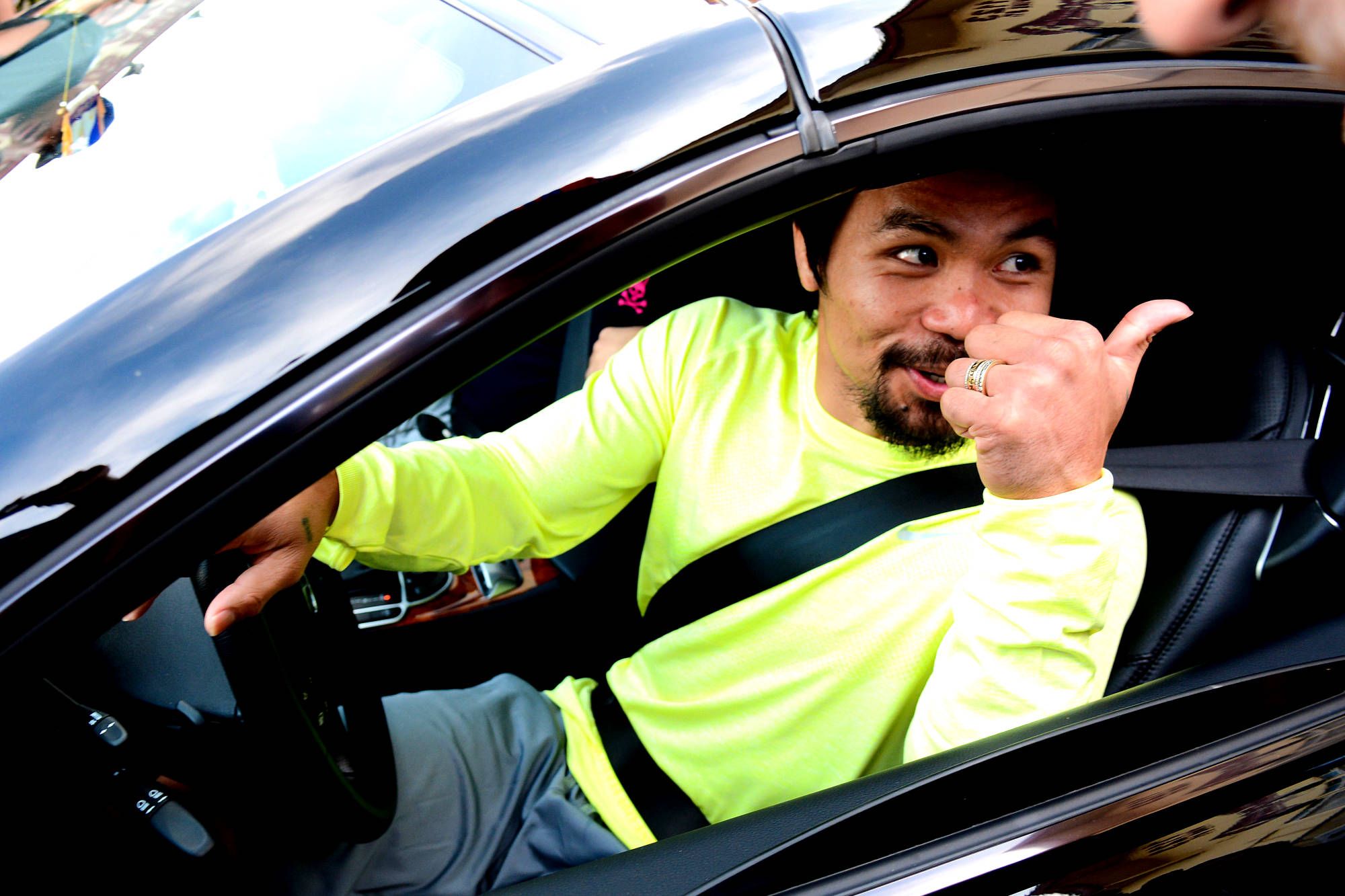 Manny Pacquiao Showing Thumbs Up In His Car
