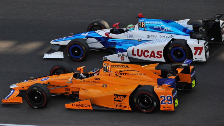 Fernando Alonso battles on track in the Indy 500