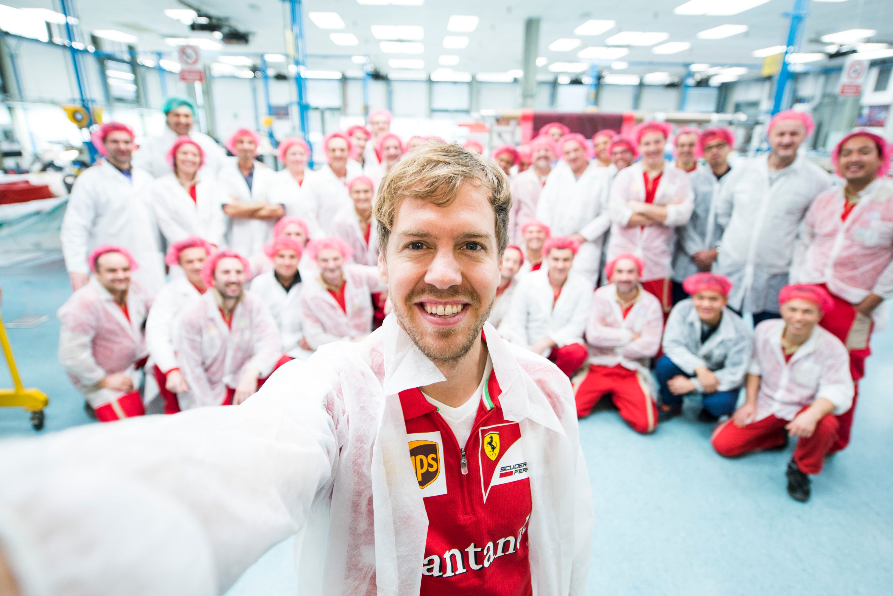 Sebastian Vettel selfie with Ferrari employees in Maranello