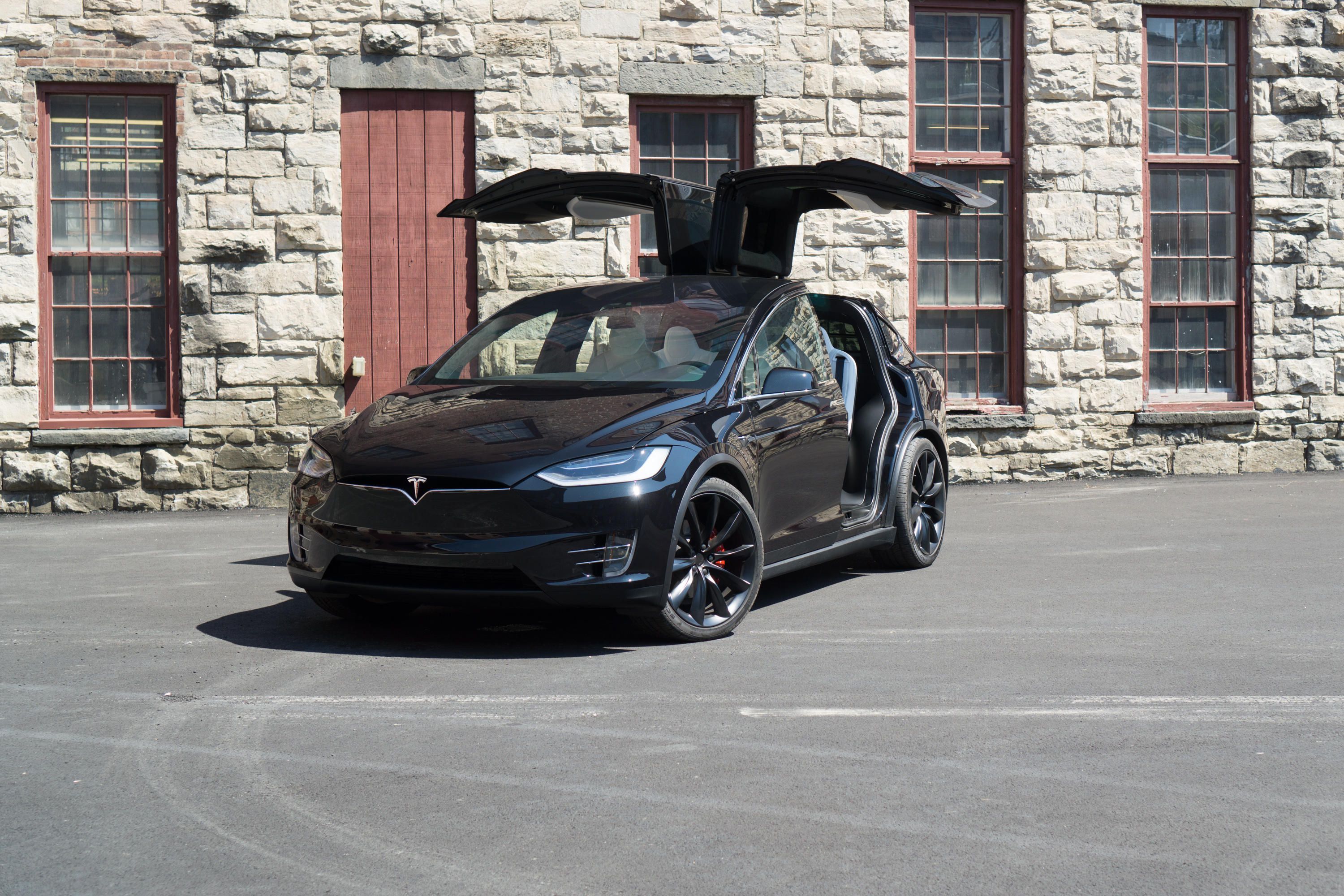 Black Tesla Model X with doors open Front 3/4 View