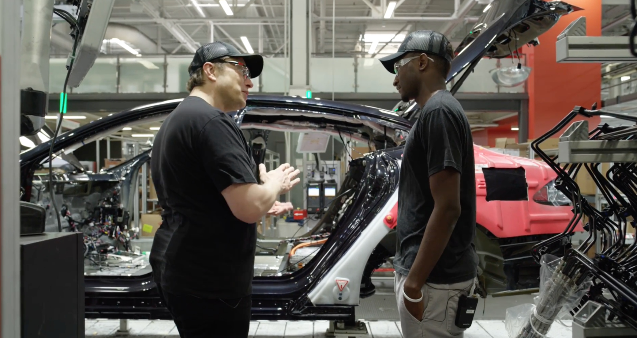 Tesla Workers discussing 