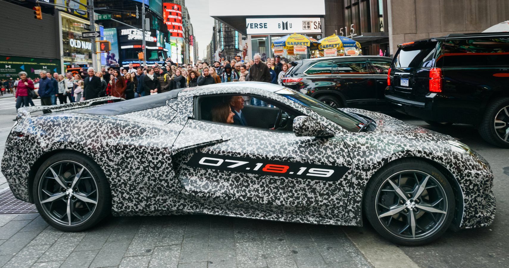 Chevrolet Corvette Chief Engineer Tadge Juechter and General Motors Chairman and CEO Mary Barra drive in a camouflaged next generation Corvette down 7th Avenue near Times Square Thursday, April 11, 2019 in New York, New York. The next generation Corvette will be unveiled on July 18. (Photo by Jennifer Altman for Chevrolet)
