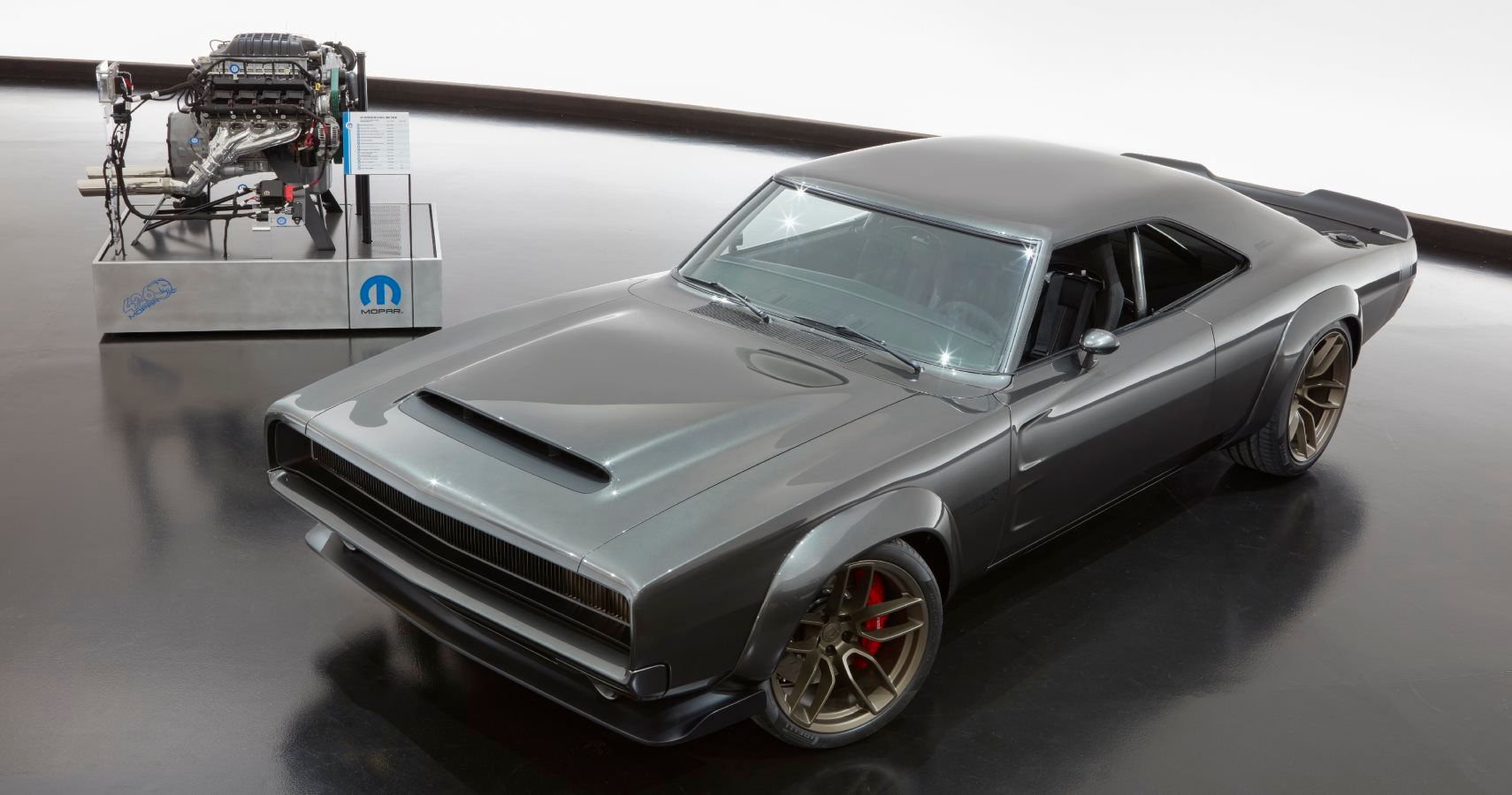 The 1968 Dodge “Super Charger” Charger Concept incorporates modern touches, including the new 1,000 horsepower “Hellephant” 426 Supercharged Mopar Crate HEMI® Engine, shown in background, to reimagine one of the most iconic vehicles ever built by FCA US.