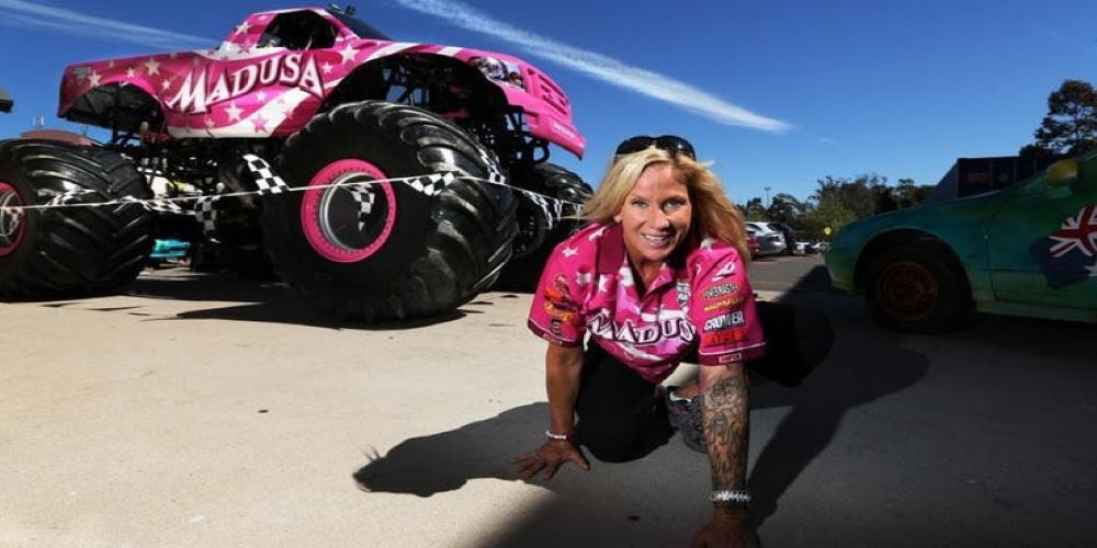 Madusa posing with her monster truck