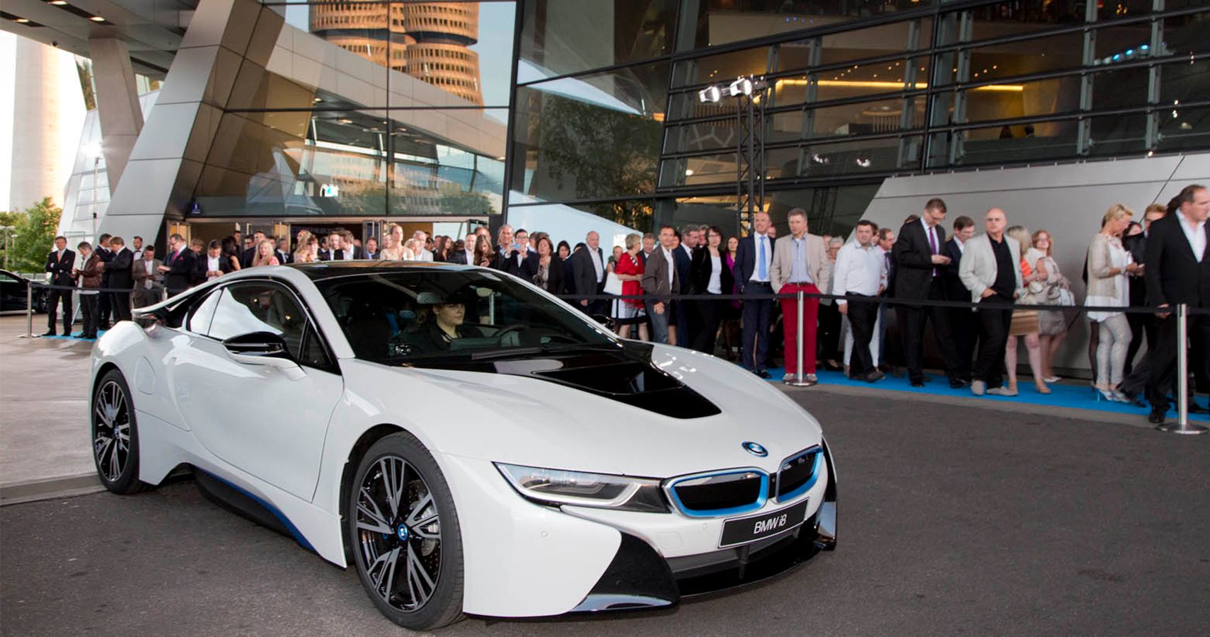 BMW i8 In Front Of Line Of People