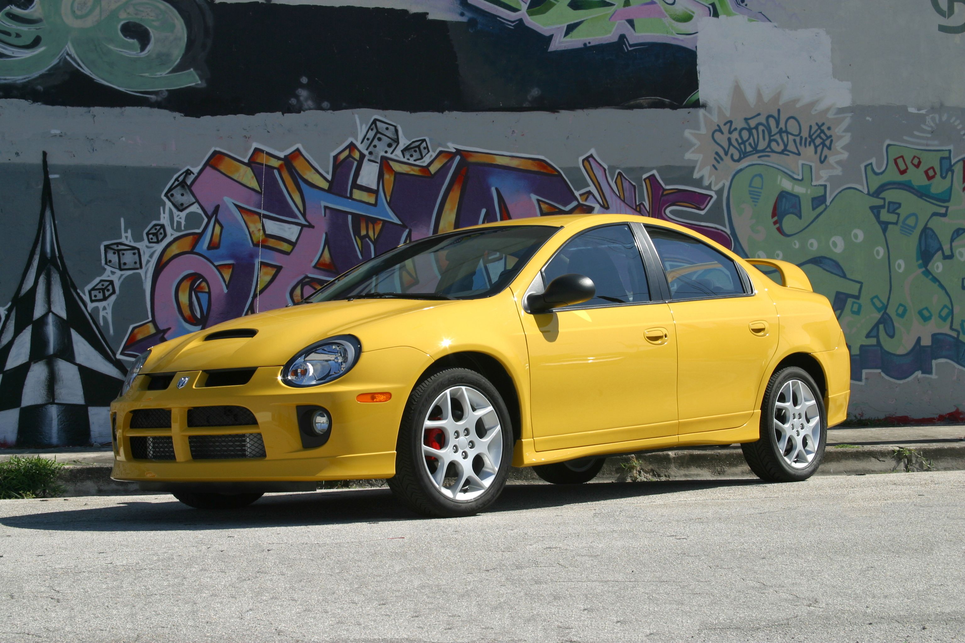 Bright Yellow 2002 Dodge Neon SRT4 grafitti