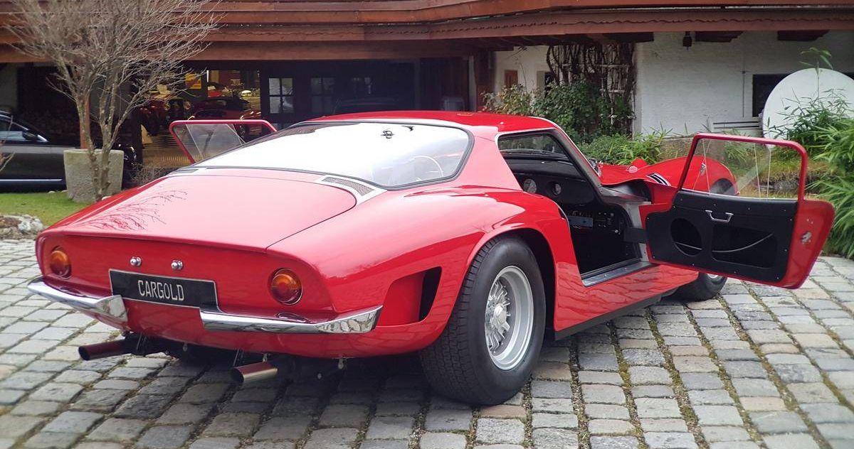 Red 1967 Bizzarrini 5300 GT Strada parked outside