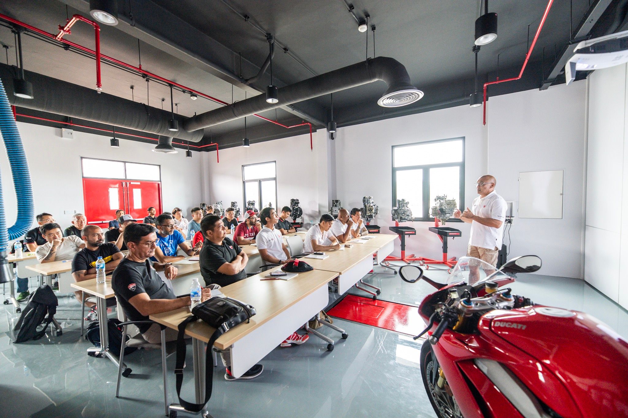 classroom full of people in a Ducati training center