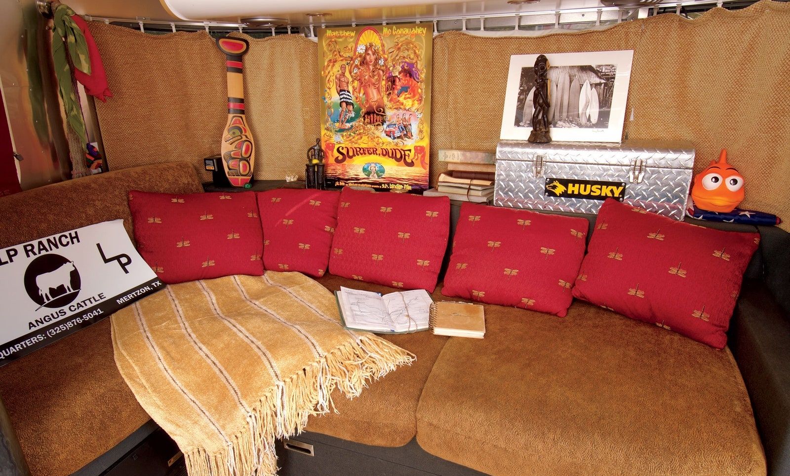 couch with cushions and posters