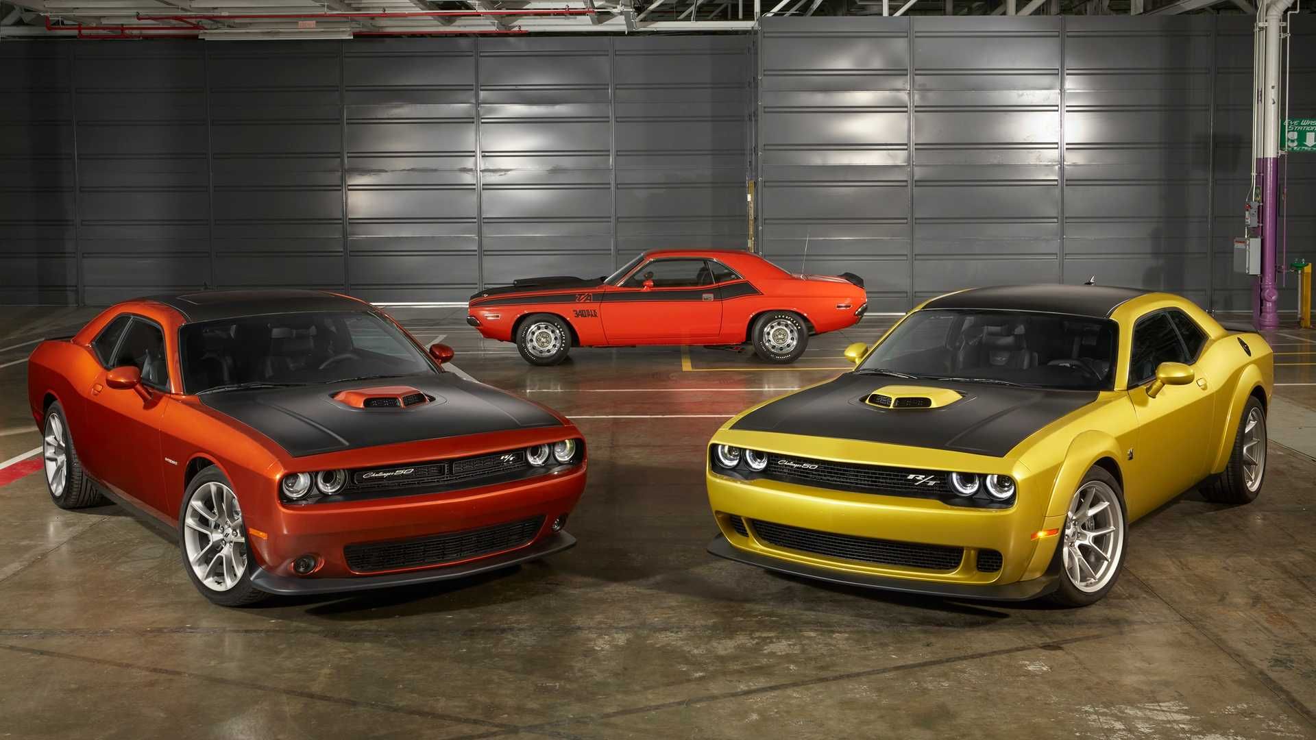 orange and yellow 2016 challengers in front of an orange first gen challenger