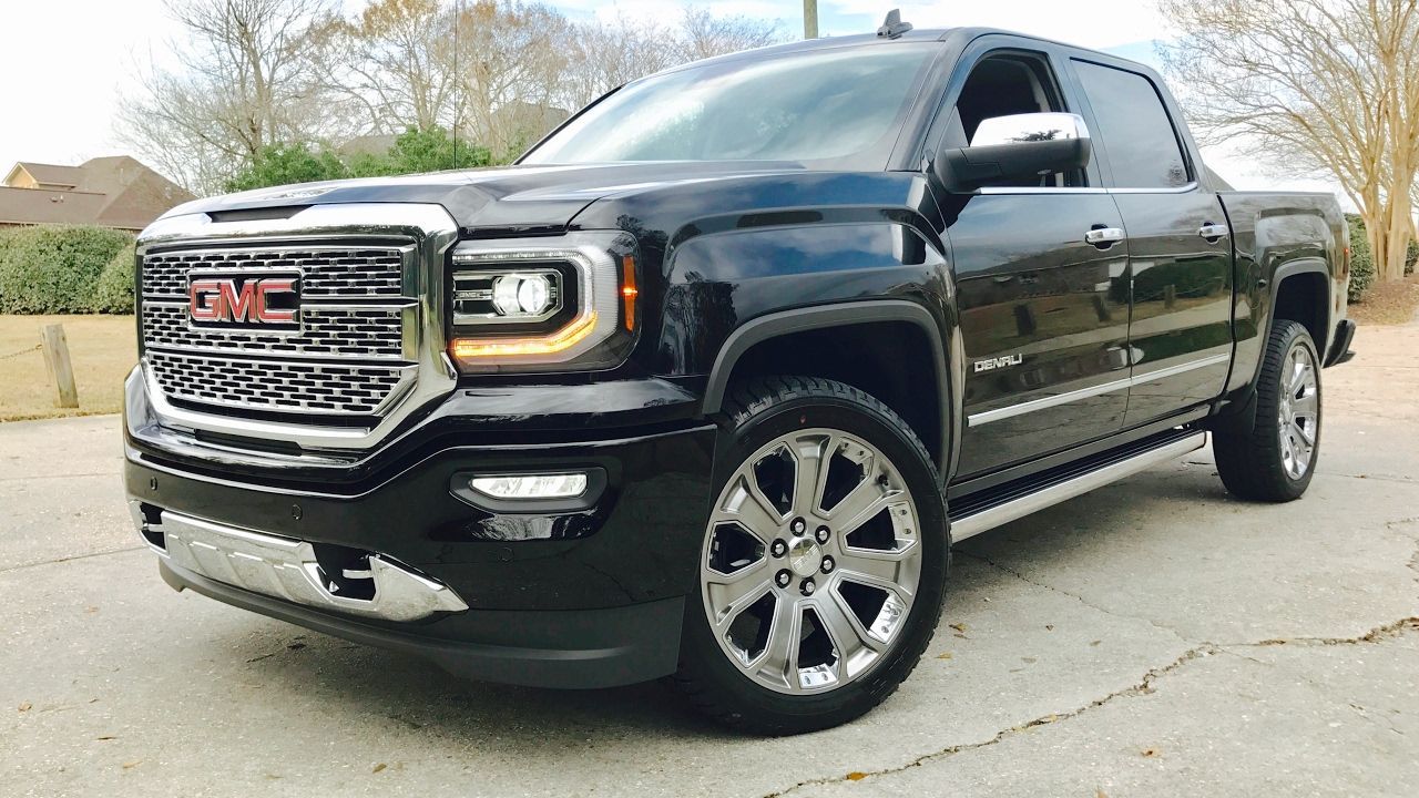 2017 GMC Sierra Denali 1500 parked with house in background