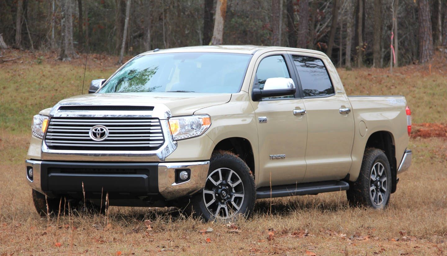 2017 Toyota Tundra 4WD SR5 CrewMax 5.5' Bed 5.7L FFV parked on grass with trees in background