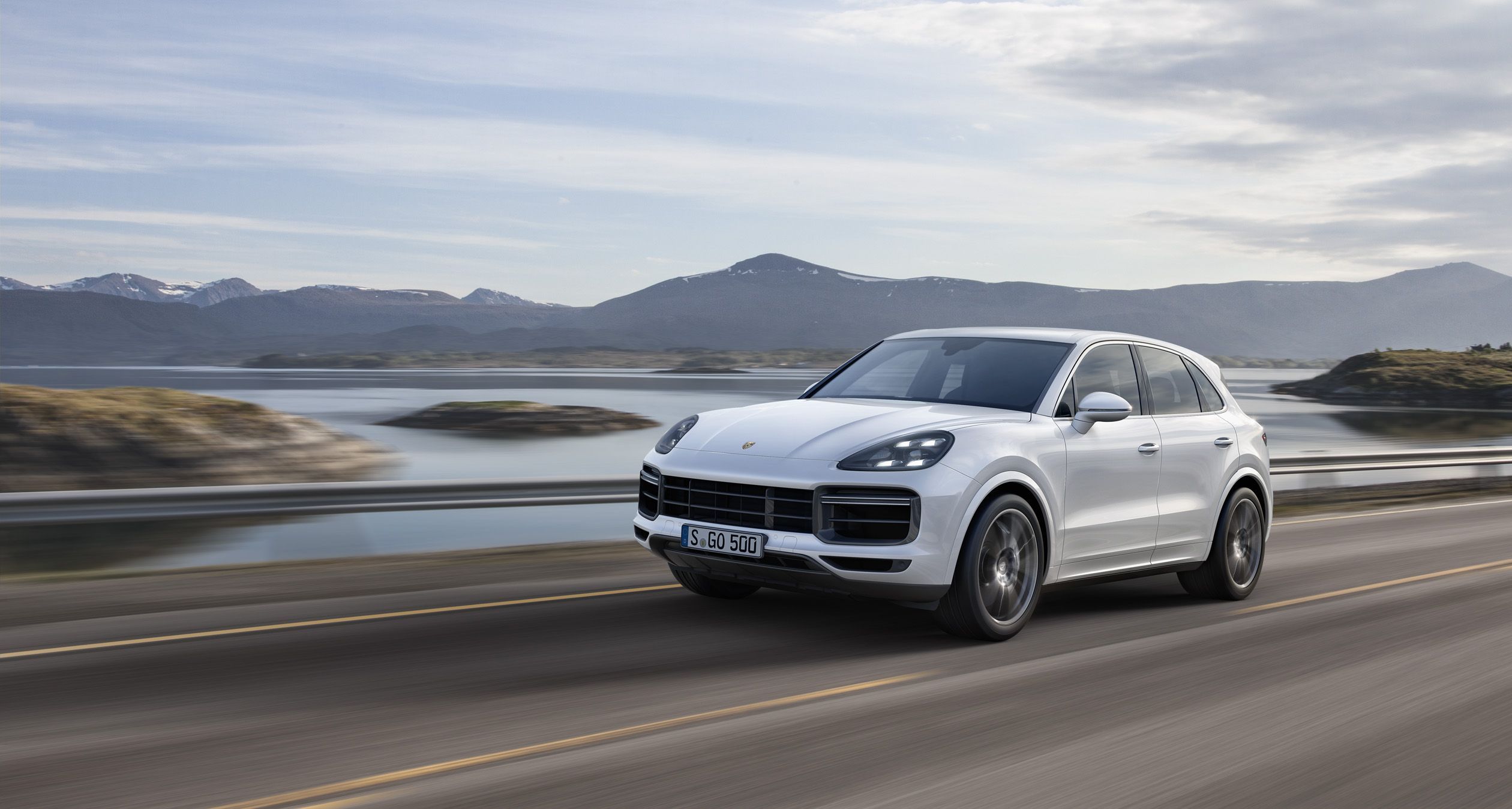 A 2019 Porsche Cayenne flying down the road