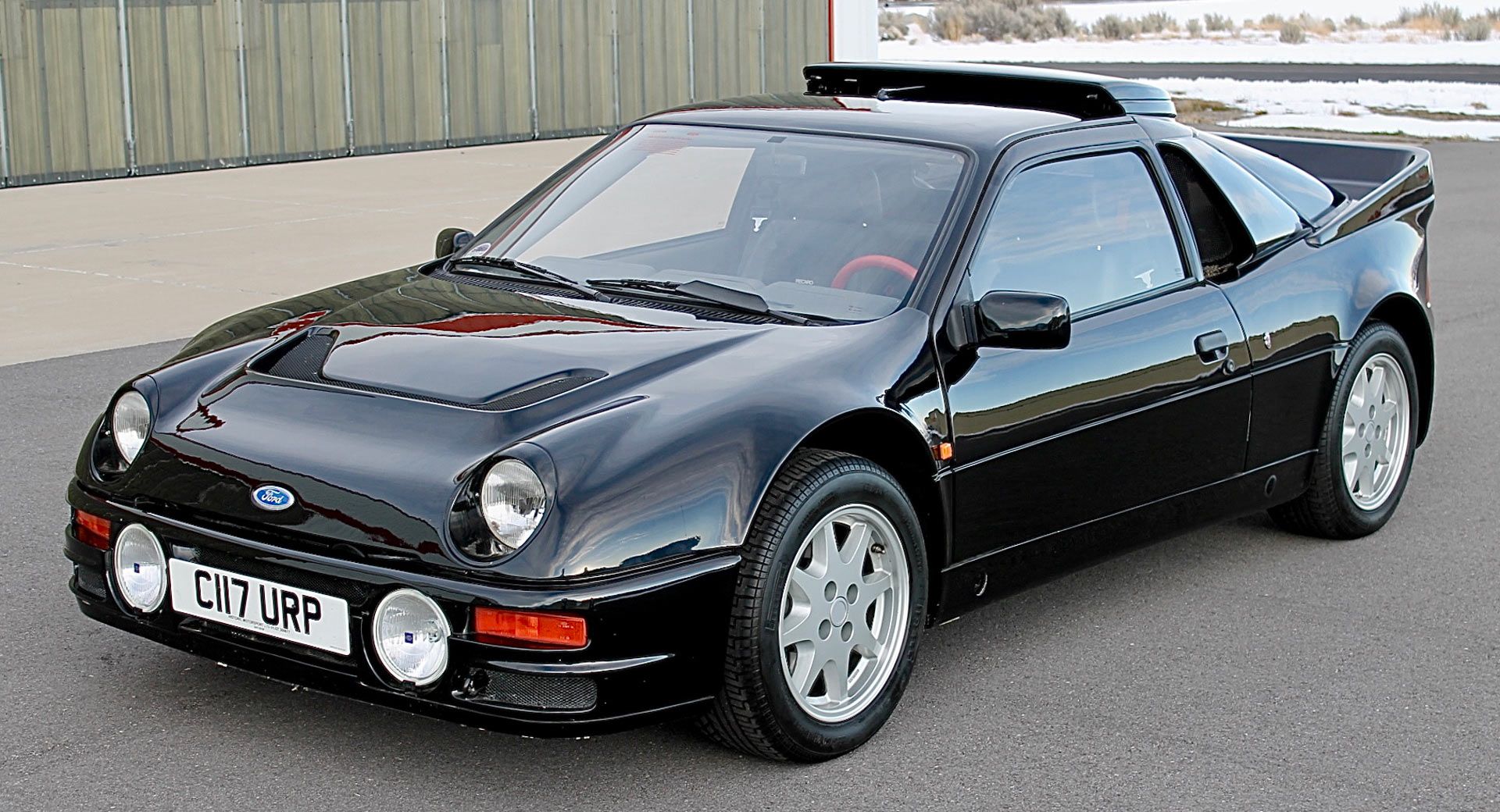 A black Ford RS200 in its commercial modification