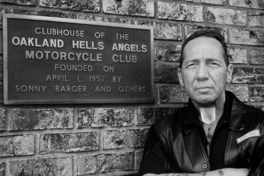 Sonny Barger poses with Oakland chapter plaque