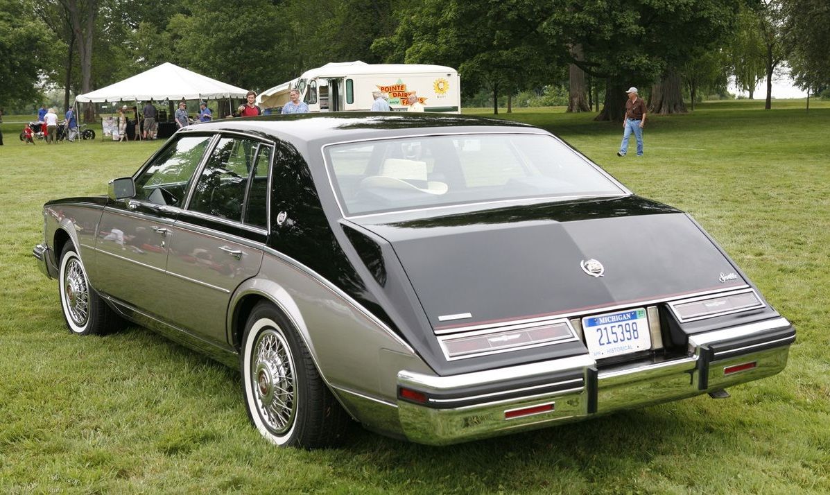 Two-tone 1980 Cadillac Seville parked on the grass