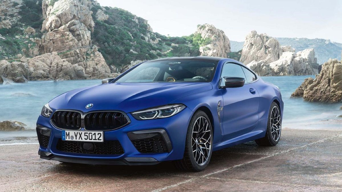 Blue BMW M8 Competition Coupe on the Shore