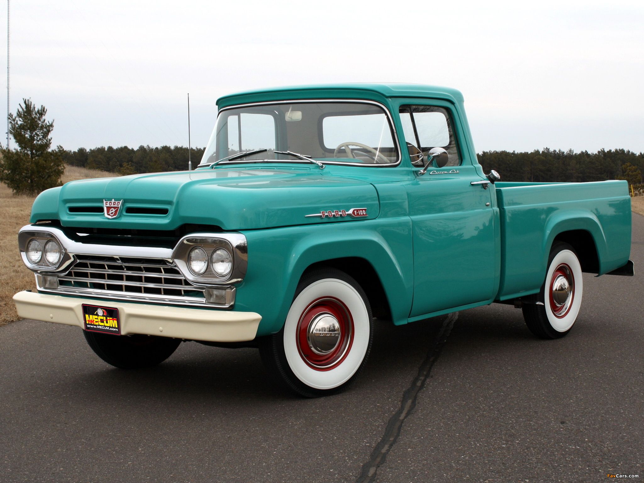 Green Ford F-100 custom cab pick up truck front view
