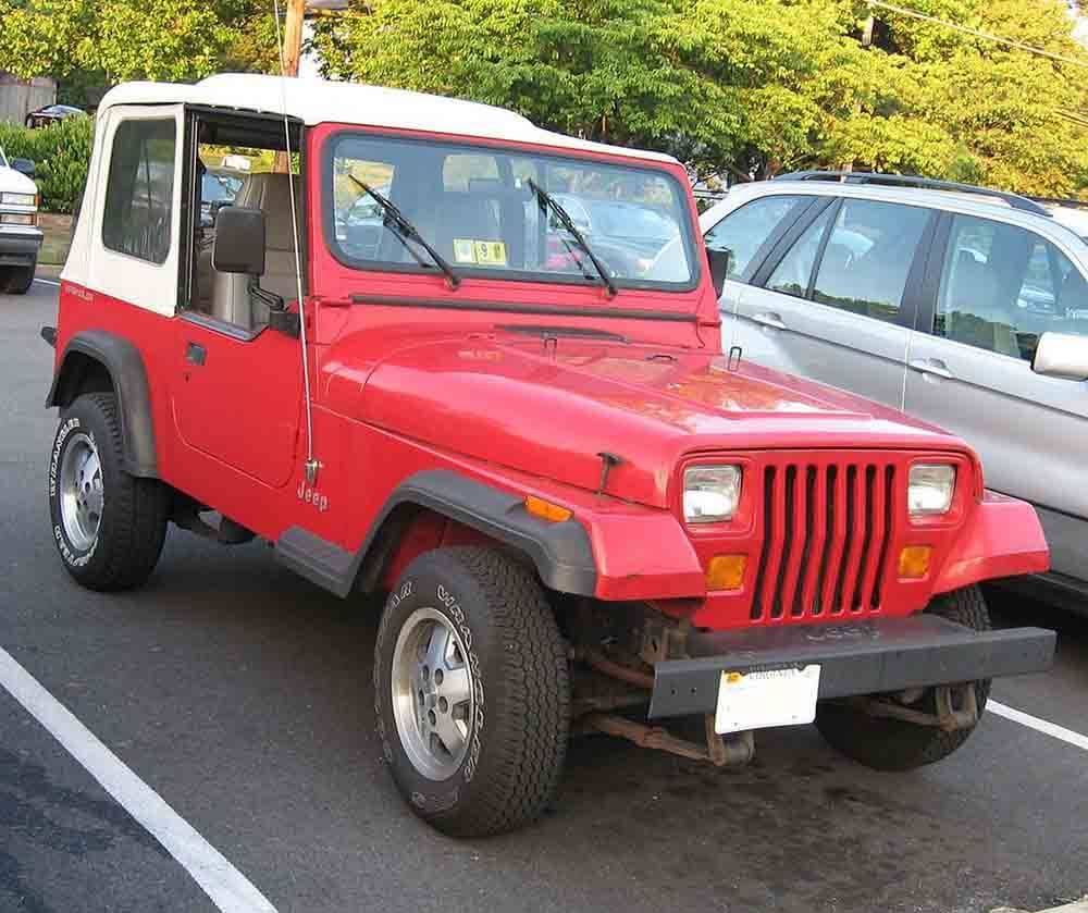 John Cena’s red 1989 Jeep Wrangler parked in a parking lot