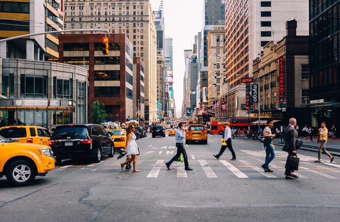 Pedestrians cross a New York city street
