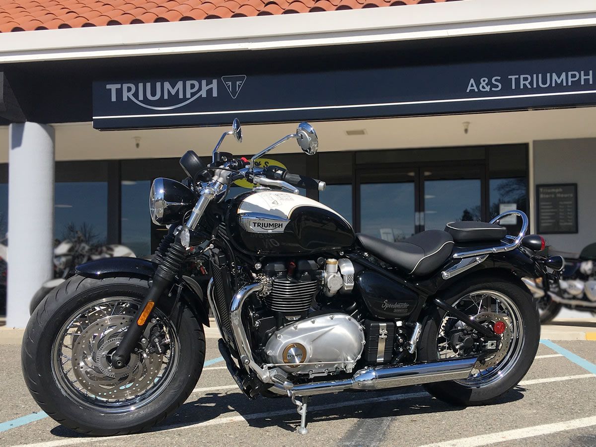 Triumph Bonneville Speedmaster parked oputside trimph motorcycles showroom
