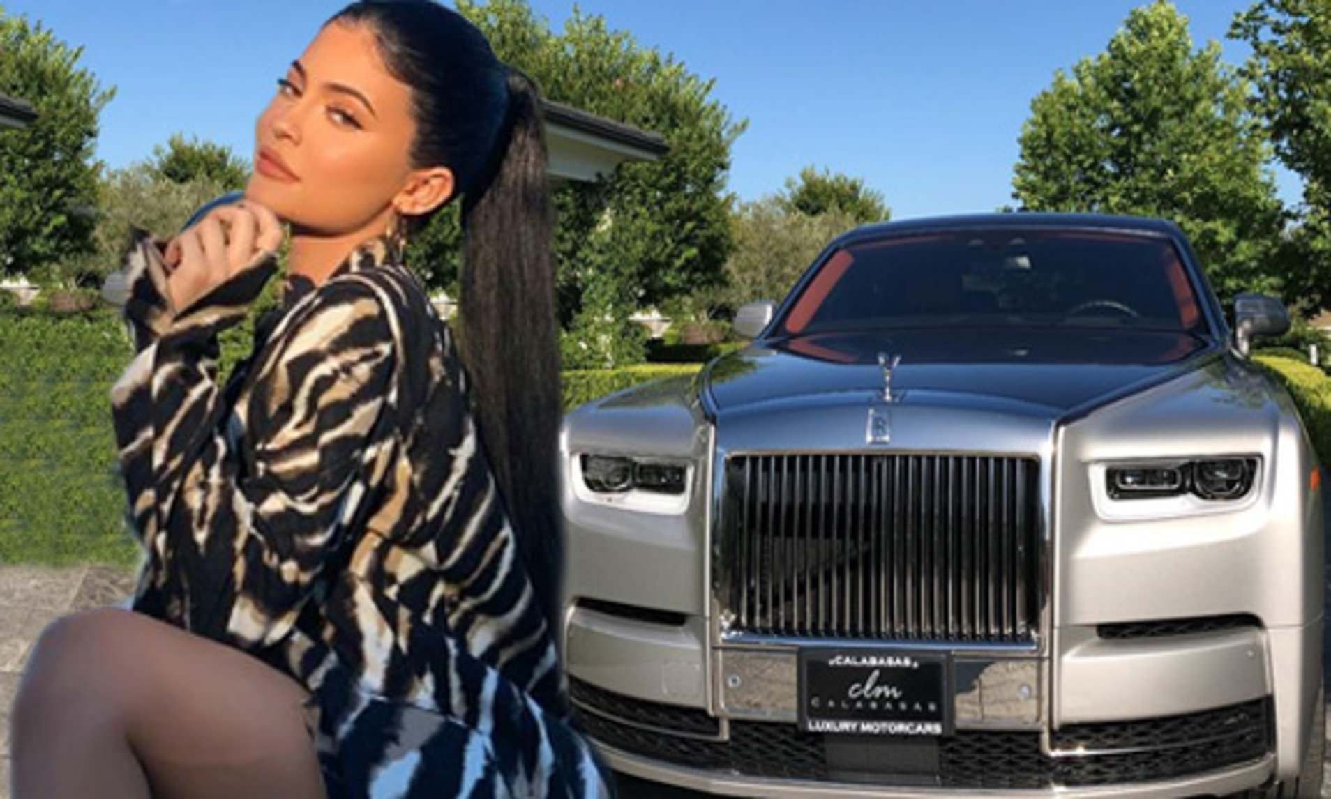 kylie jenner kneels down next to her brand new rolls royce