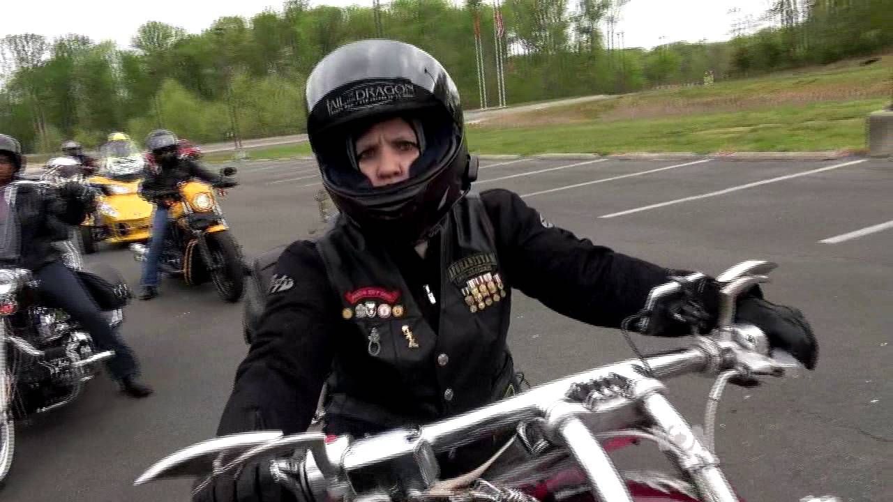 women riding motorcycle