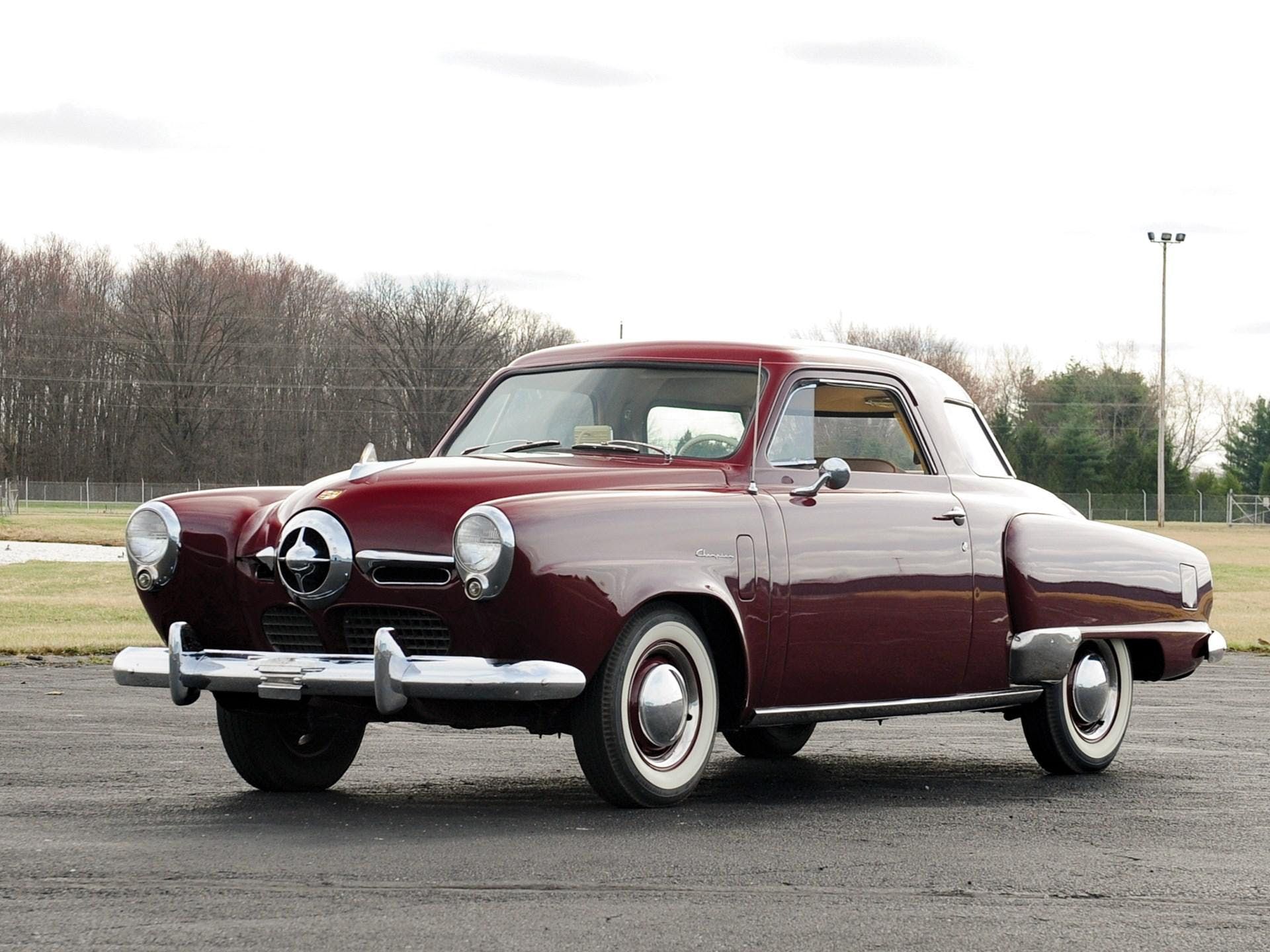 1950 Studebaker Champion parked in an empty lot
