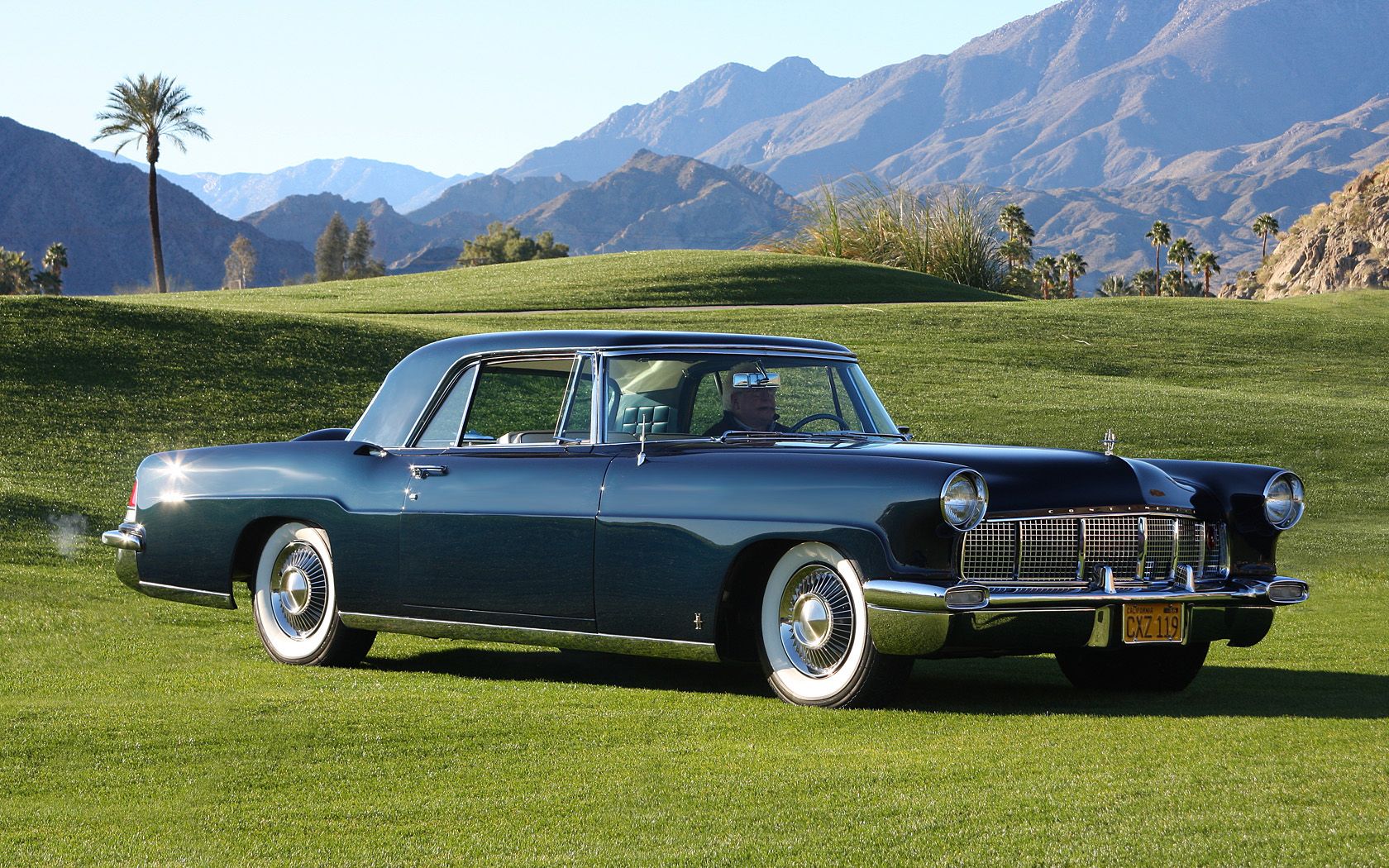 A navy blue 1950s Lincoln Continental