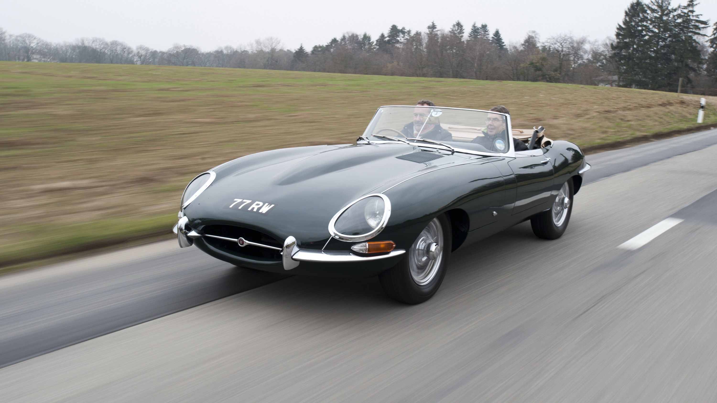 A classic jaguar e-type on the highway