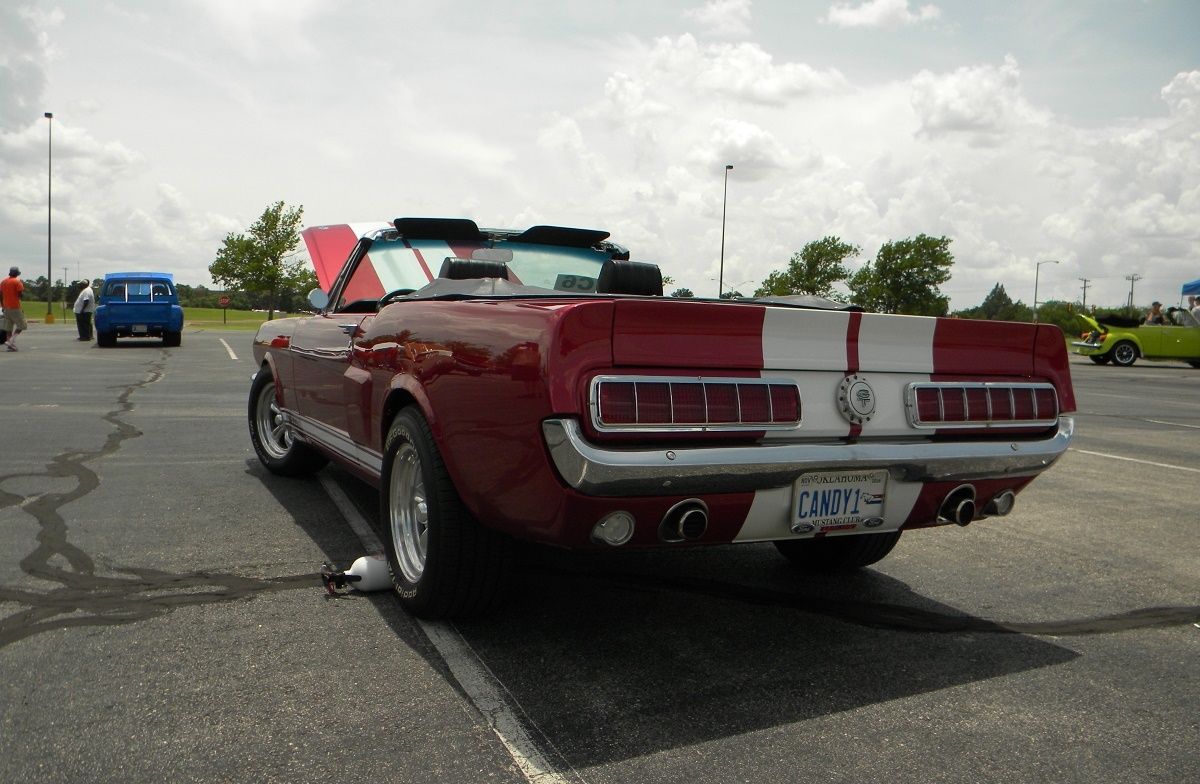 Dark Candy Apple Red 1968 Ford Mustang California Special in a parking lot