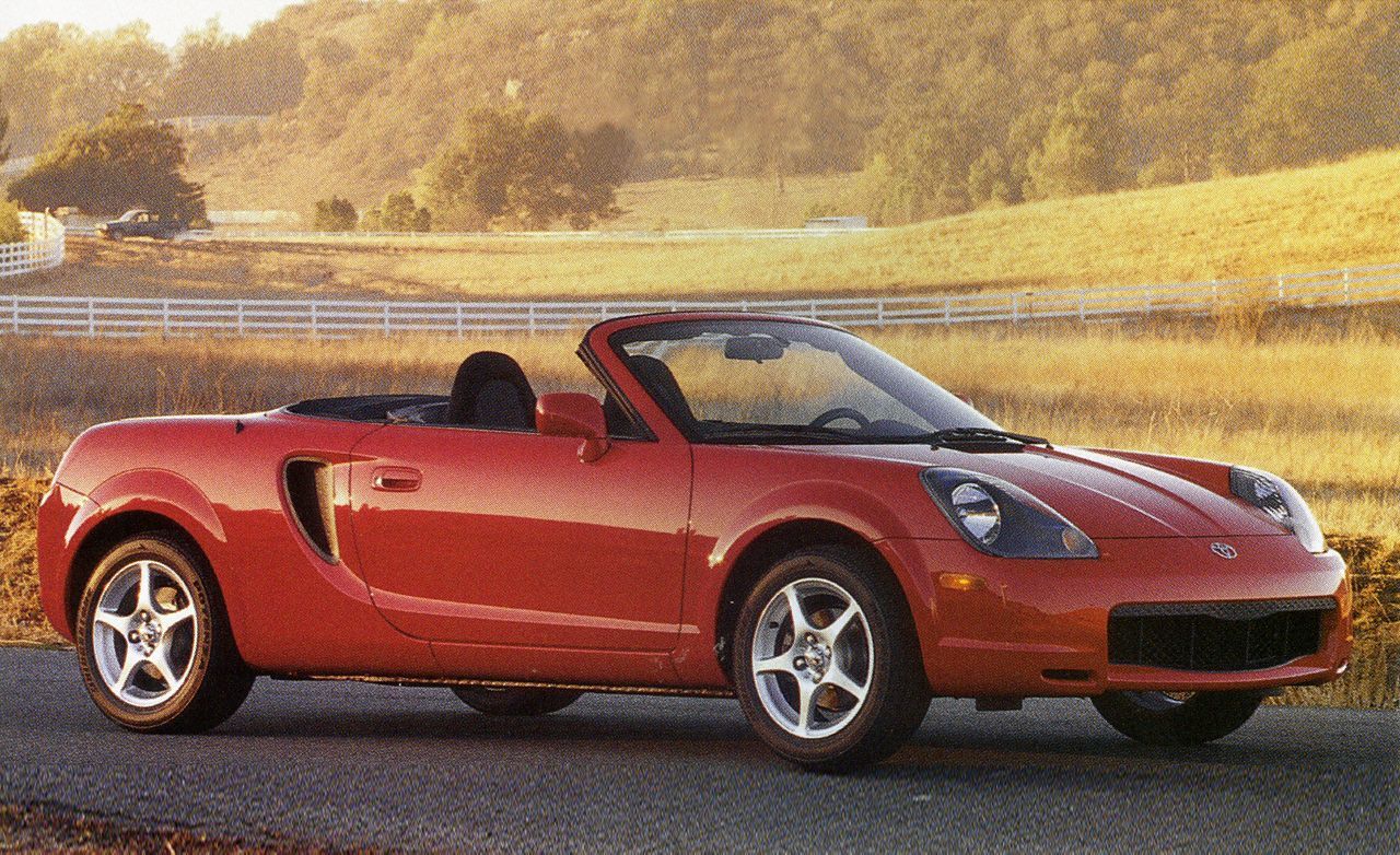Absolutely Red 2000 Toyota MR2 parked on the countryside 