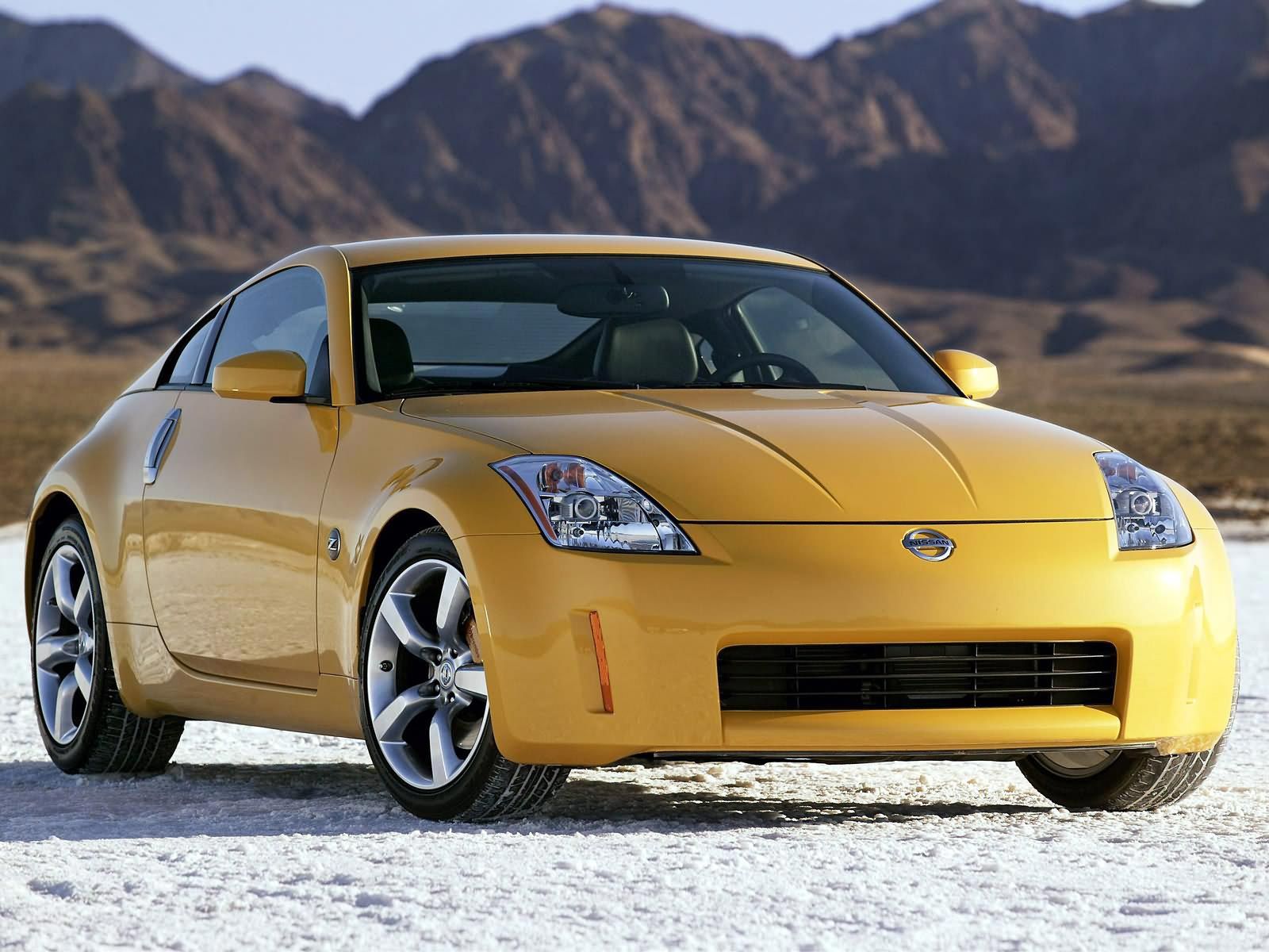 Ultra Yellow 2003 Nissan 350Z parked on a snow-covered surface