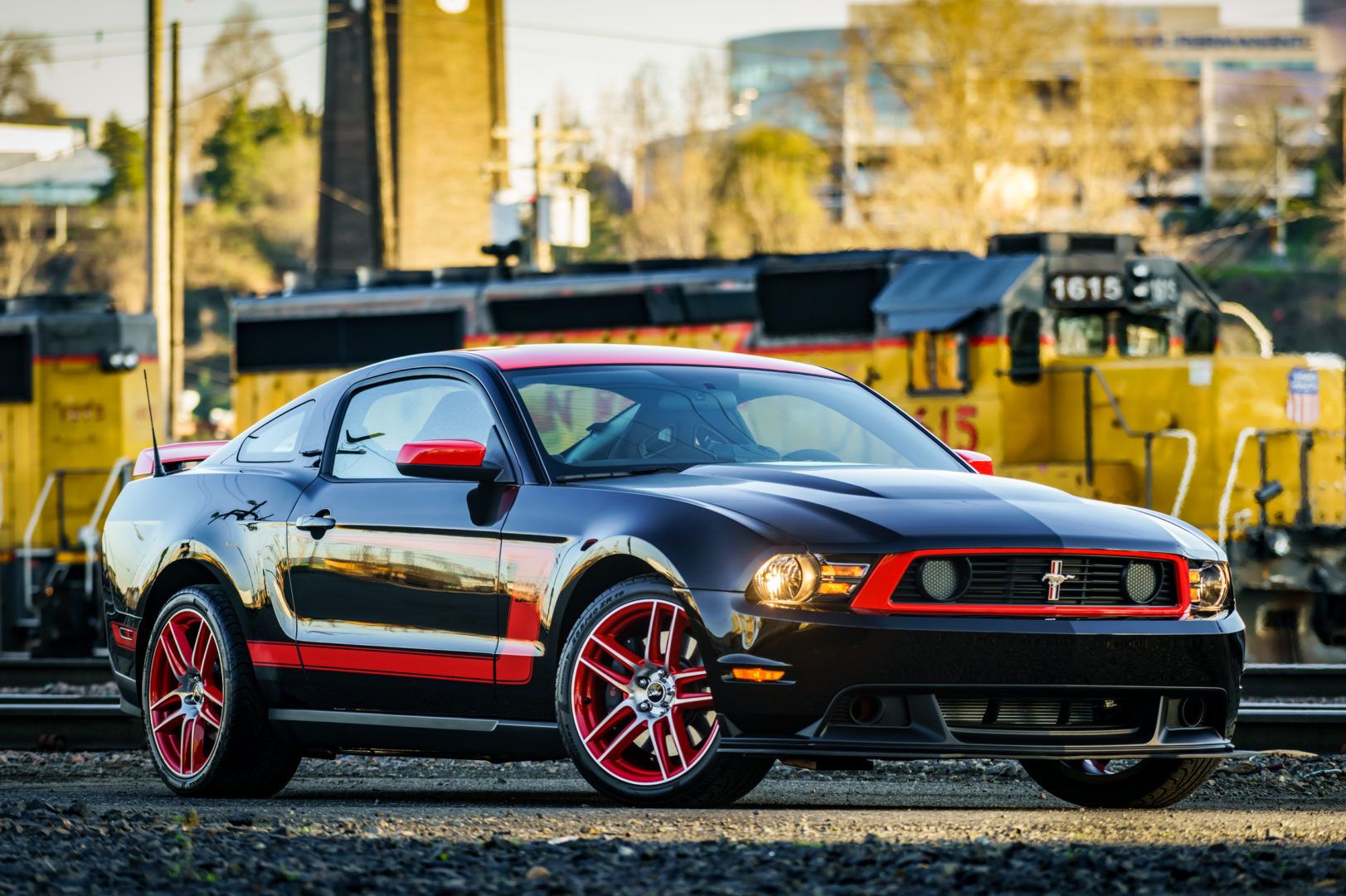 Black and Red 2012 Ford Mustang Boss 302 Laguna Seca in a train station