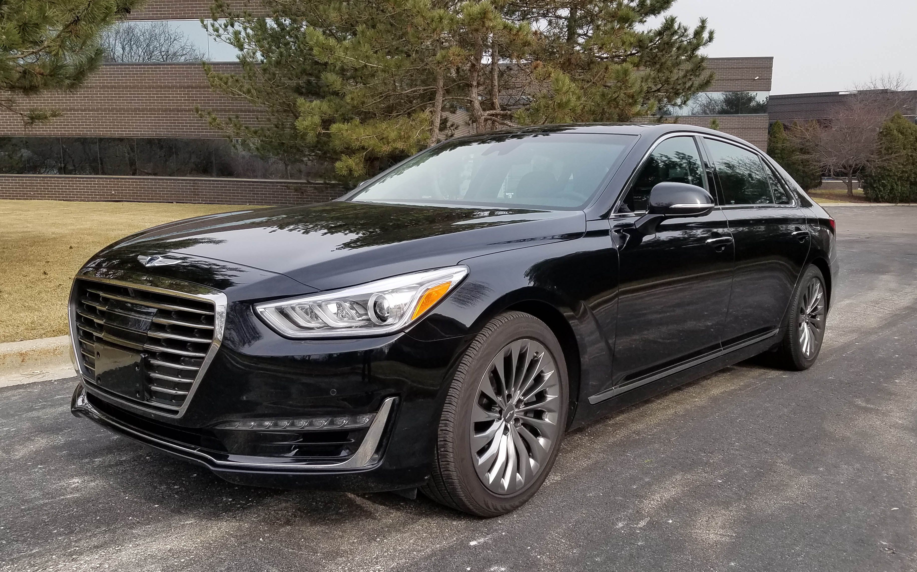 Genesis G90 5.0 Ultimate parked outside