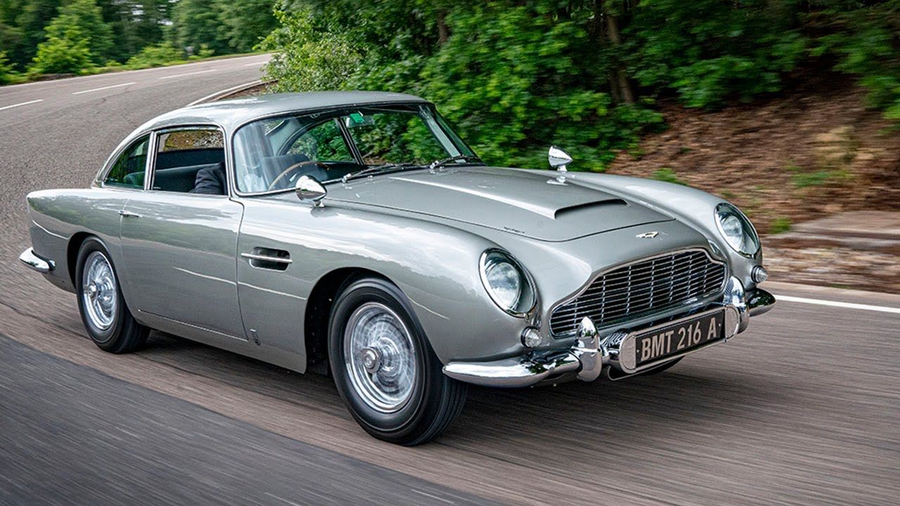 A classic Aston Martin DB5 taking the bend like a pro