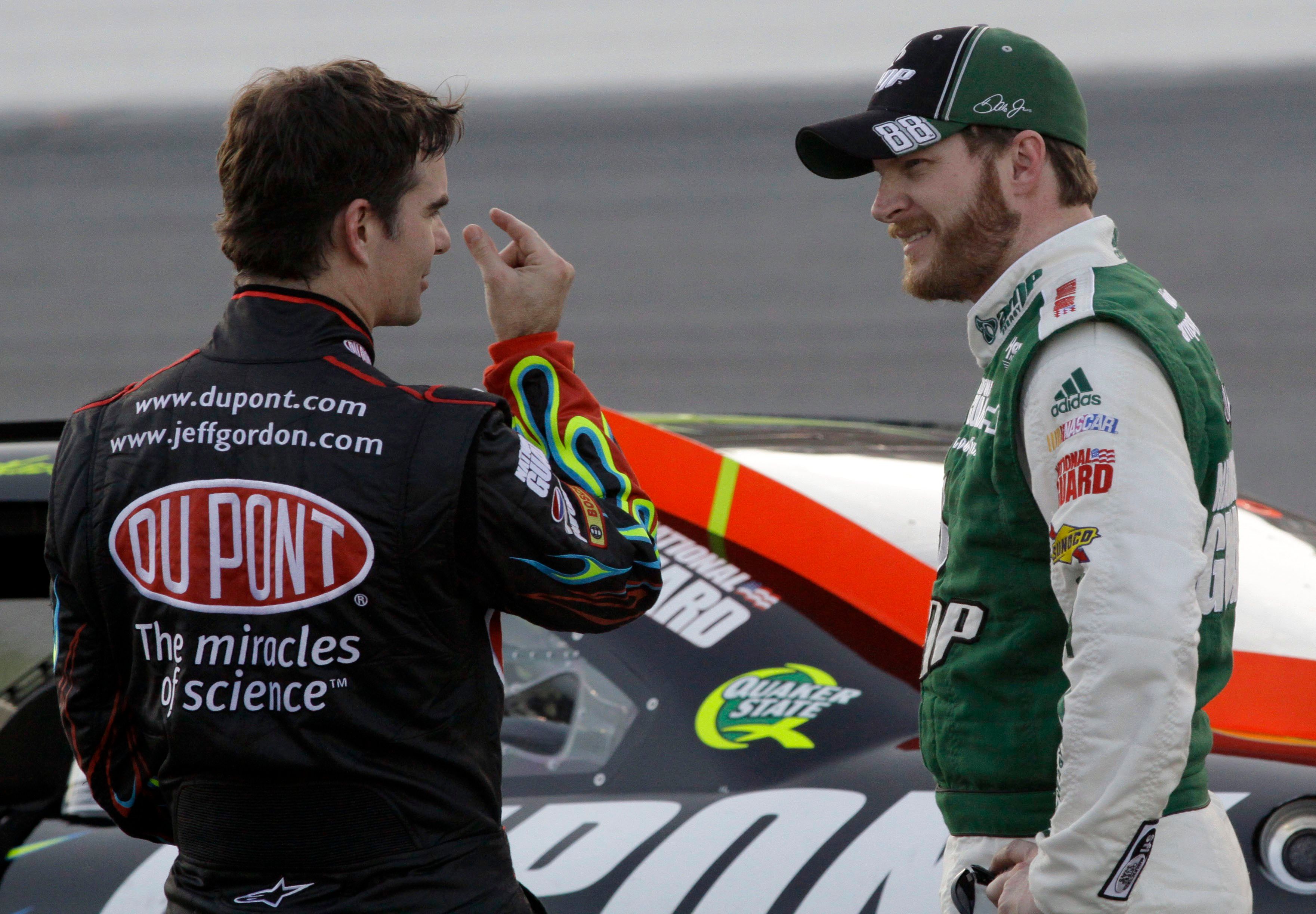 Jeff Gordon, left, and Dale Earnhardt Jr. chat during the second red-flag delay at the Daytona 500 due to a pothole