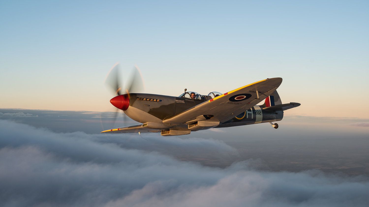 Spitfire Above Clouds