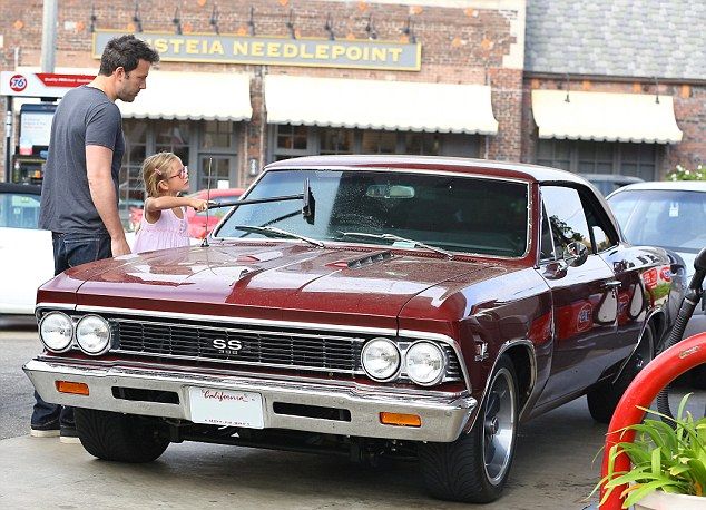 Ben Affleck watches while daughter cleans his Chevelle