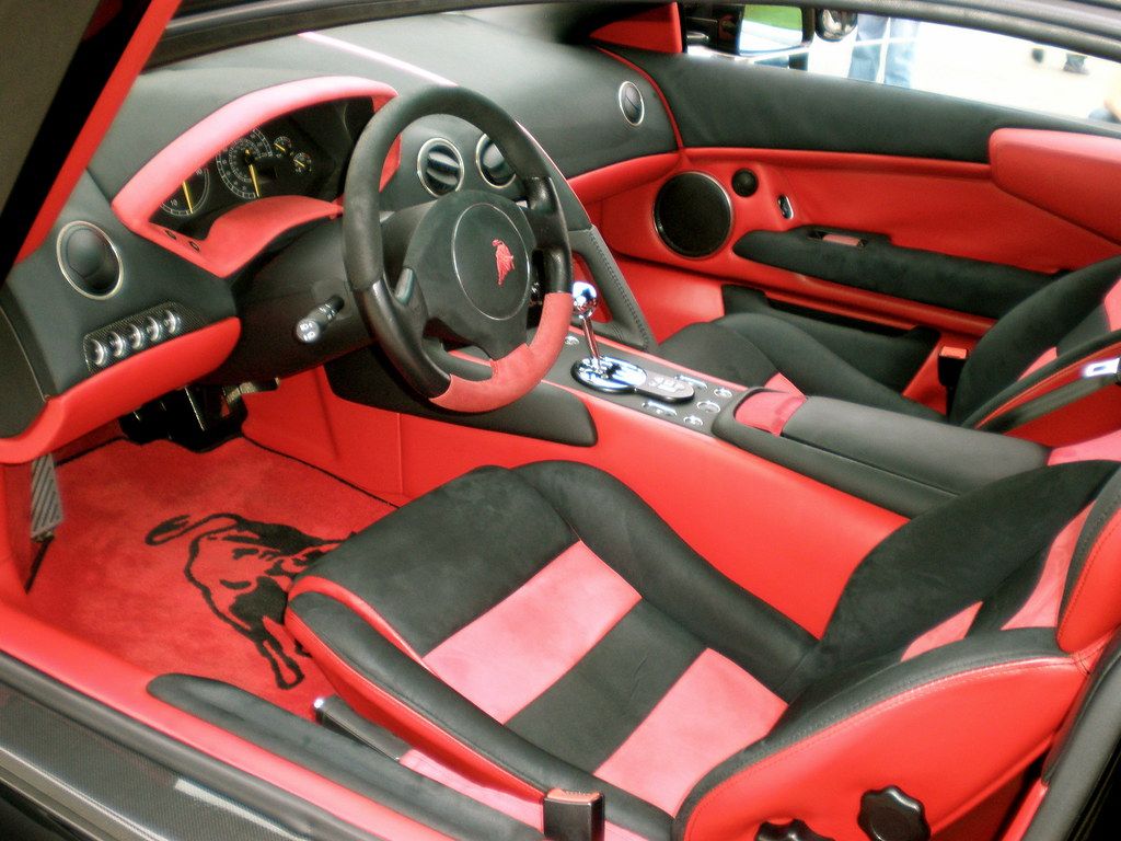 Interior of a Lamborghini Murcielago that has a stick shift