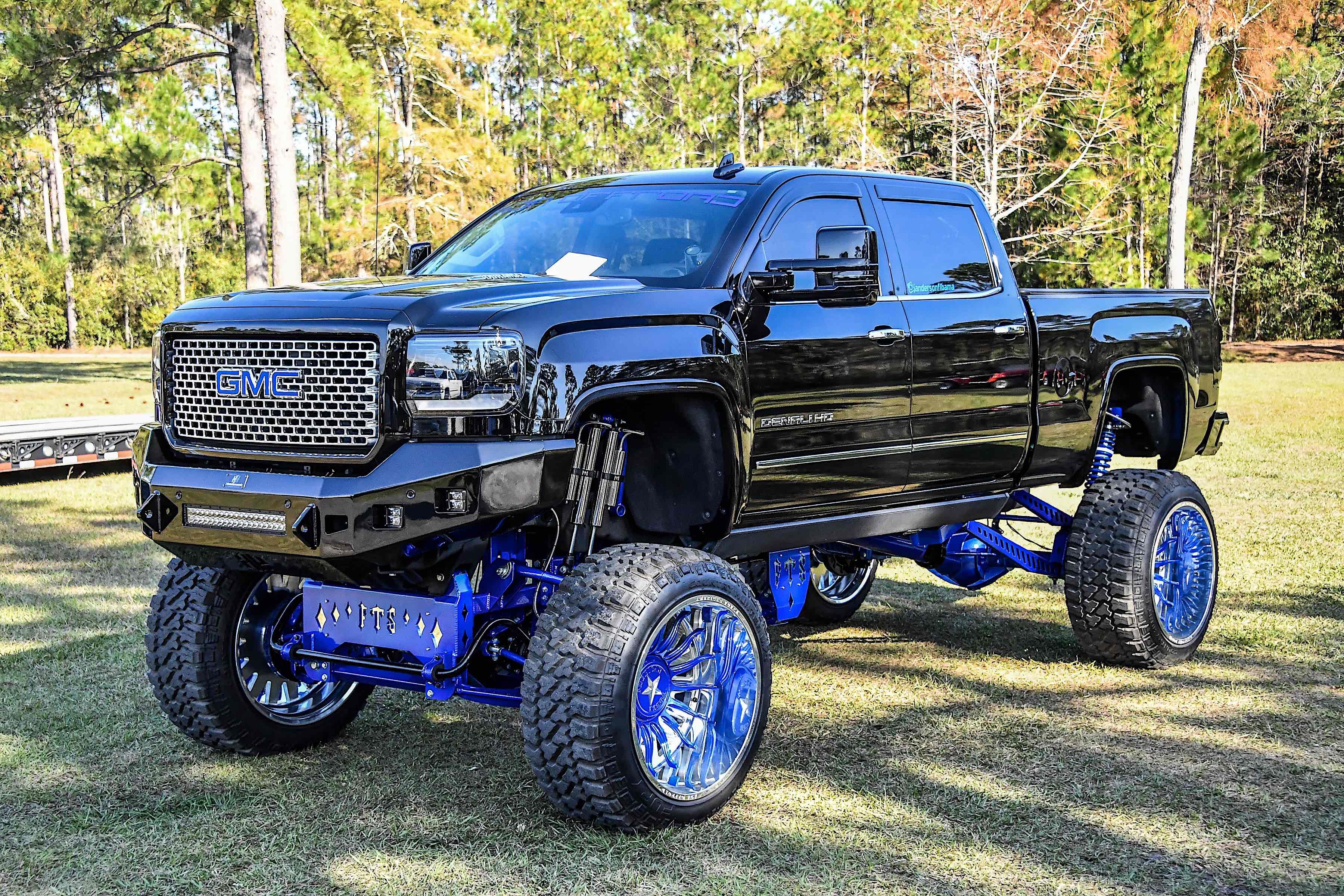A lifted GMC truck