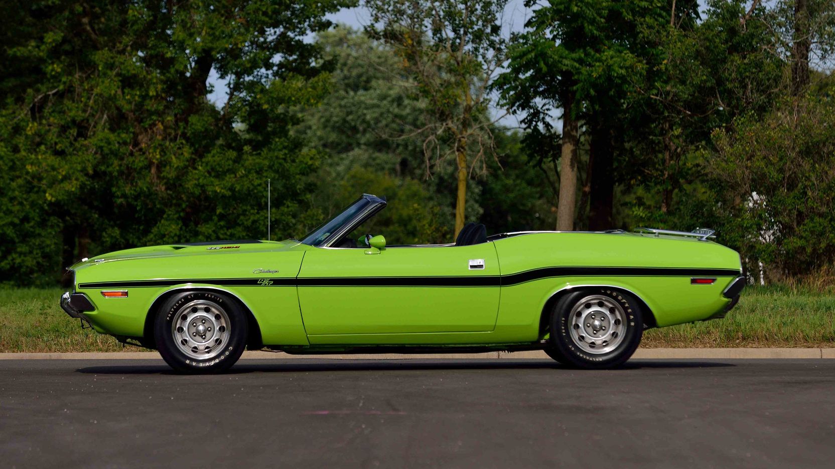 Side view of a A rare sublime green 1970 Dodge Challenger R/T Hemi Convertible 