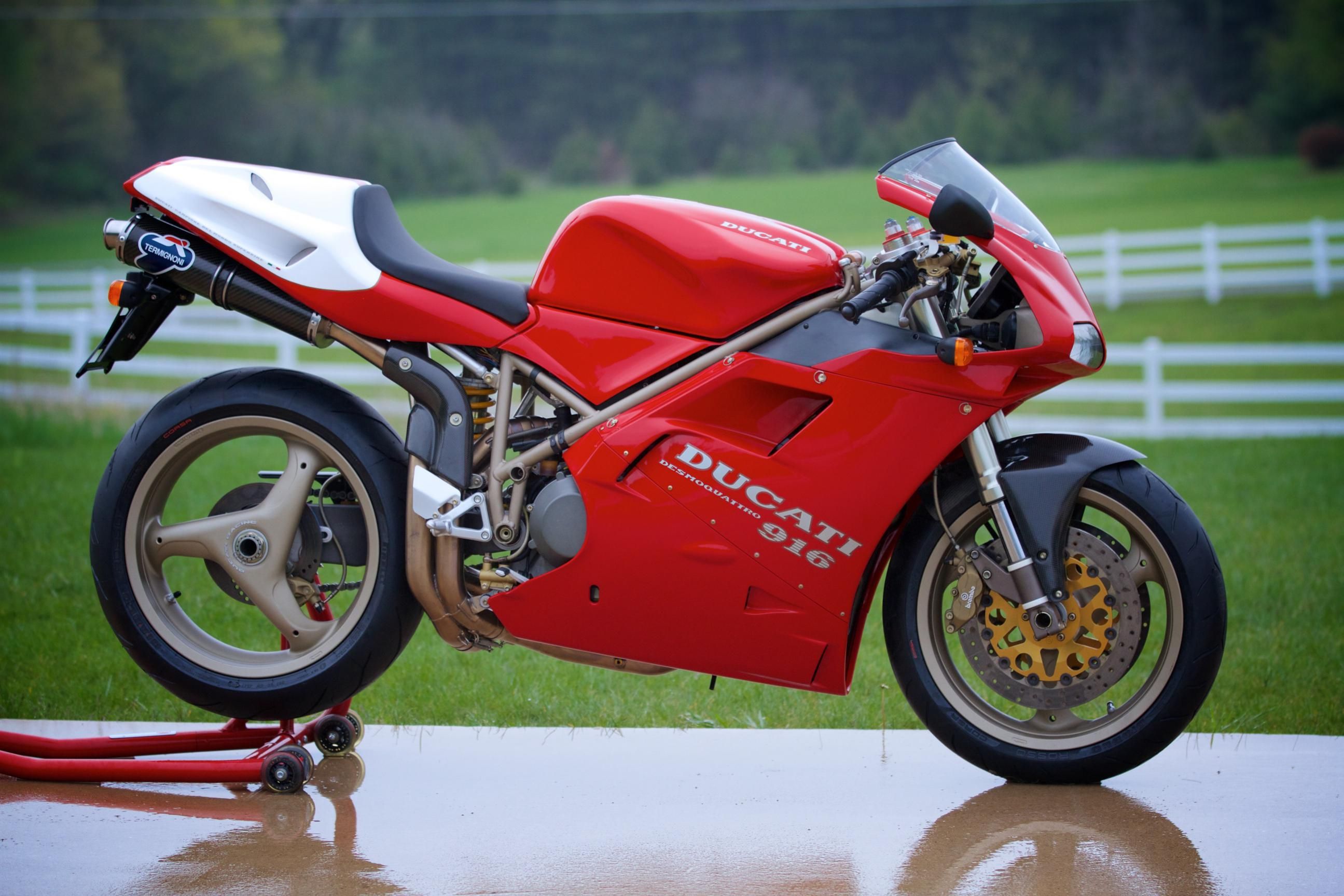 red 1996 Ducati 916SPS at a ranch