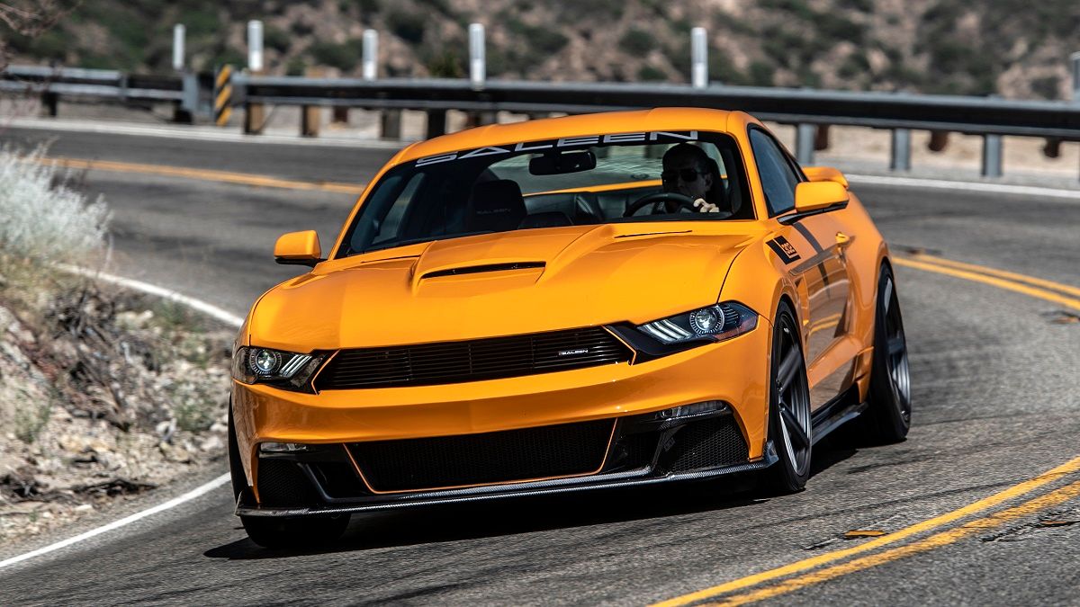 Orange fury 2019 Saleen S302 Black Label while passing a road bend